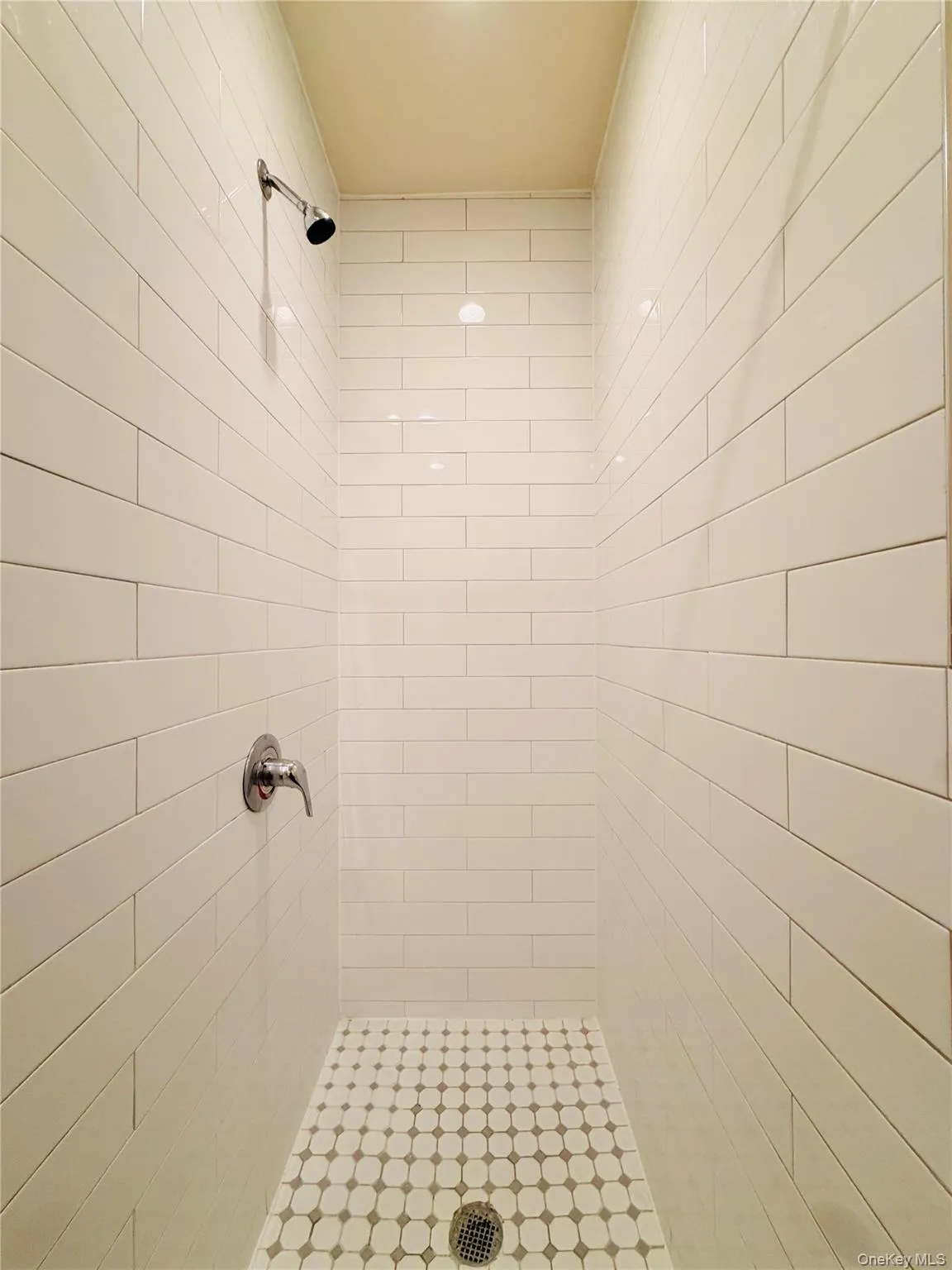 Full bath with a shower stall Full bath with a shower stall