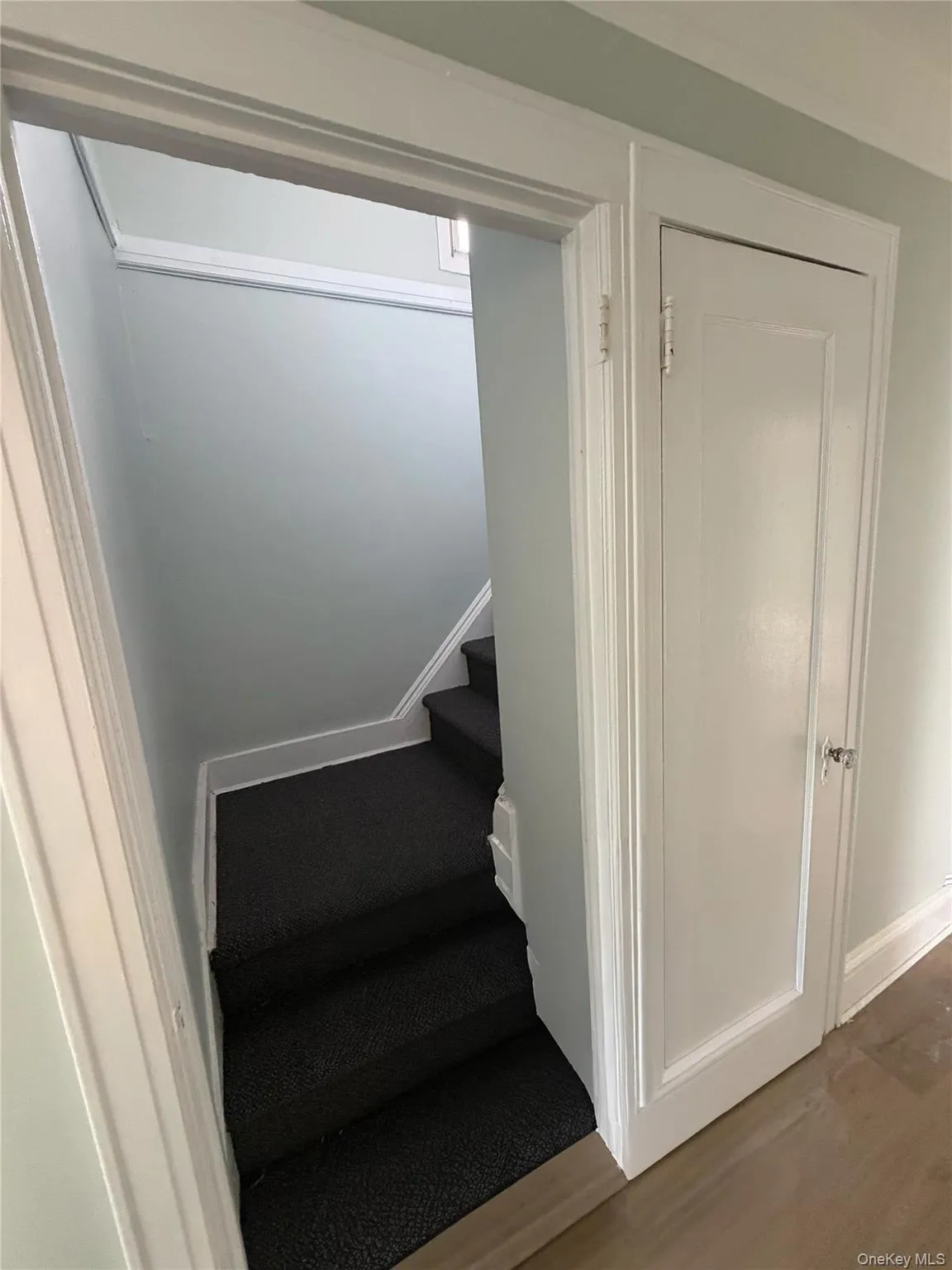 Staircase featuring wood finished floors and baseboards Staircase featuring wood finished floors and baseboards