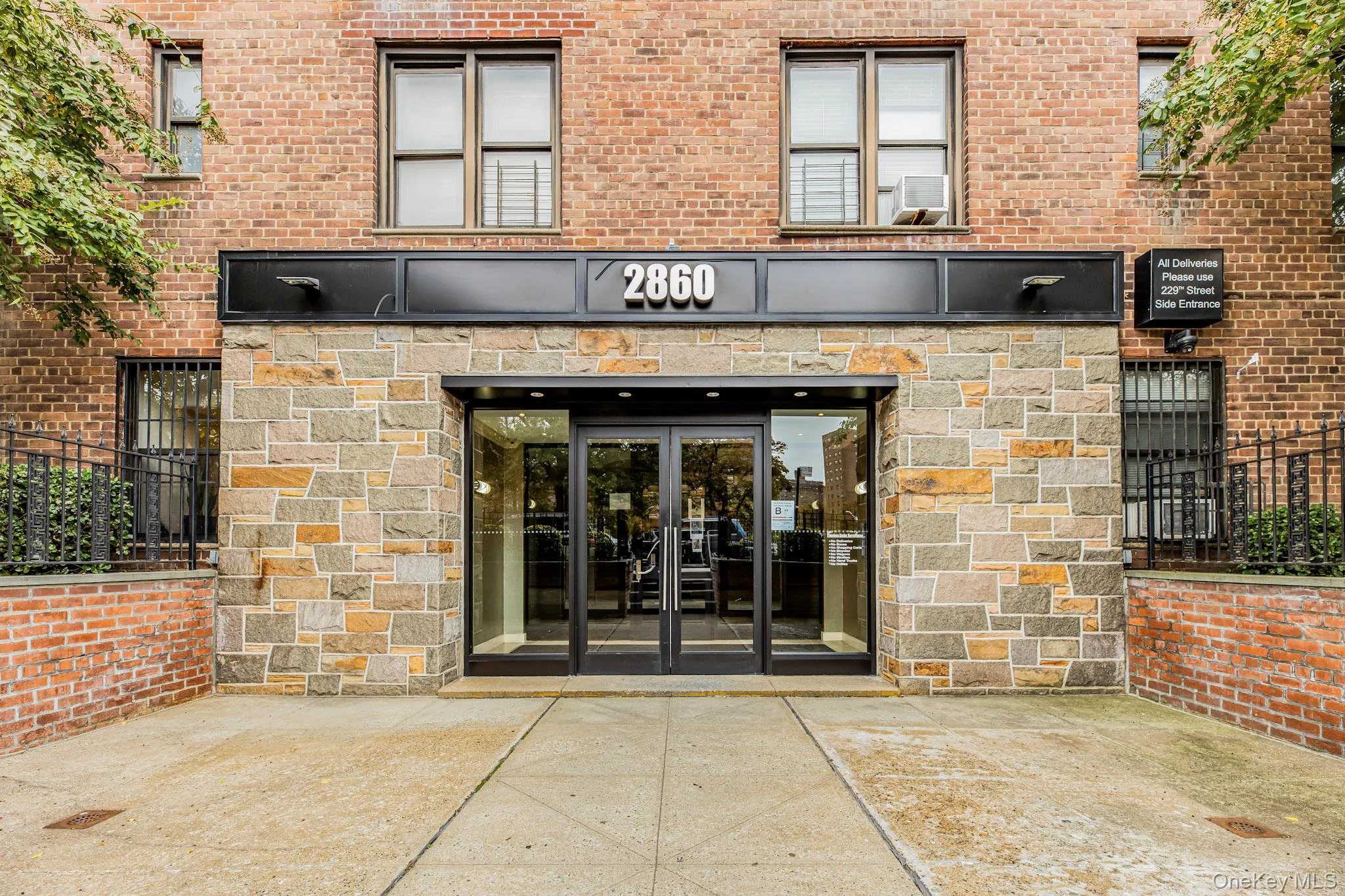Property entrance featuring french doors and brick siding Property entrance featuring french doors and brick siding