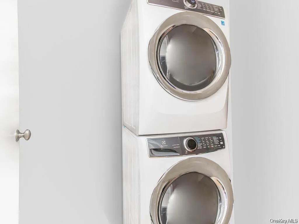 Laundry area with estacked washer and dryer Laundry area with estacked washer and dryer