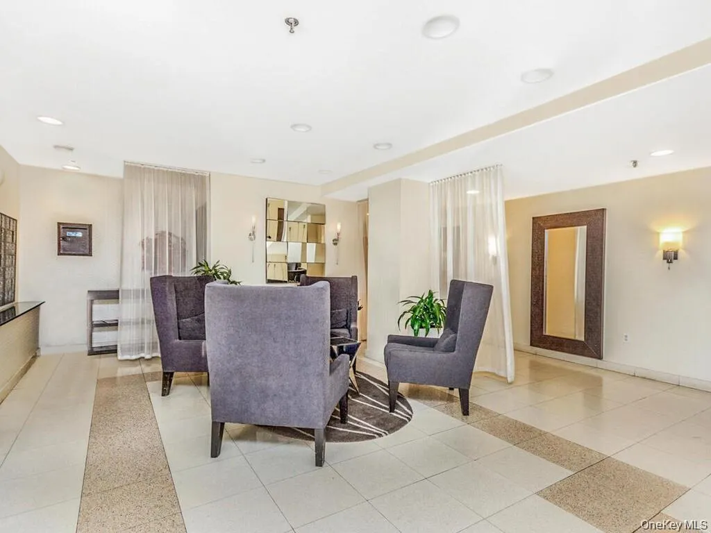 Building lobby featuring recessed lighting Building lobby featuring recessed lighting