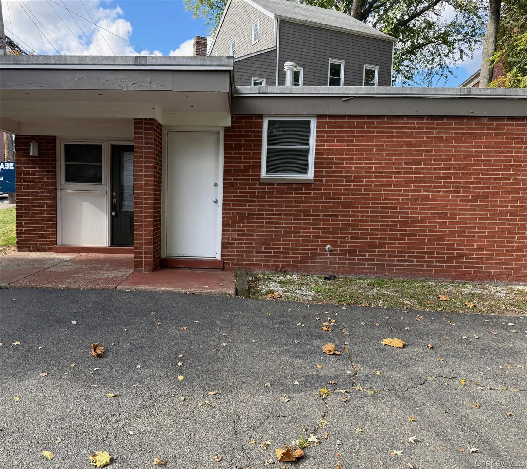 Property entrance with brick siding Property entrance with brick siding