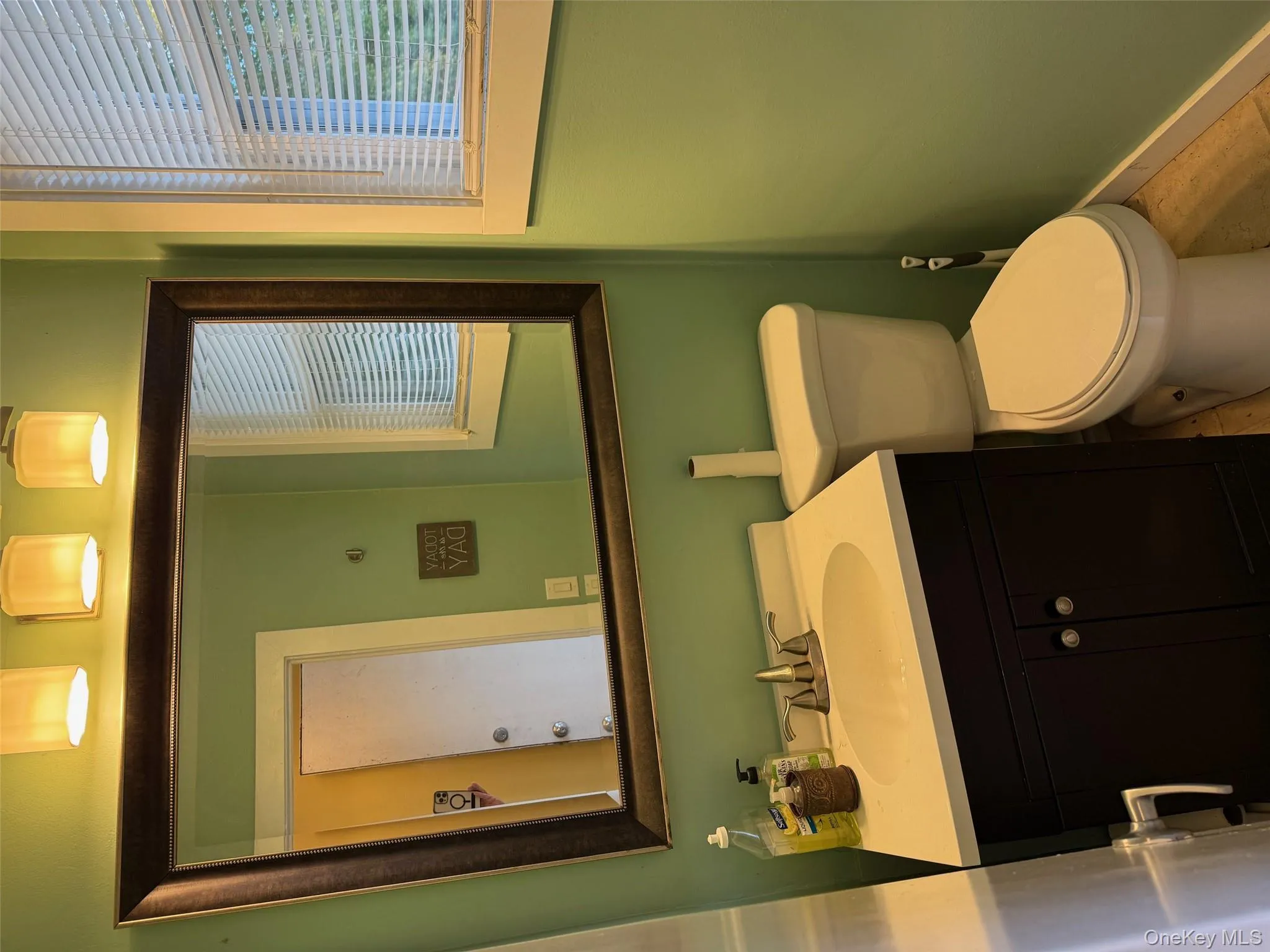Bathroom featuring vanity and healthy amount of natural light Bathroom featuring vanity and healthy amount of natural light