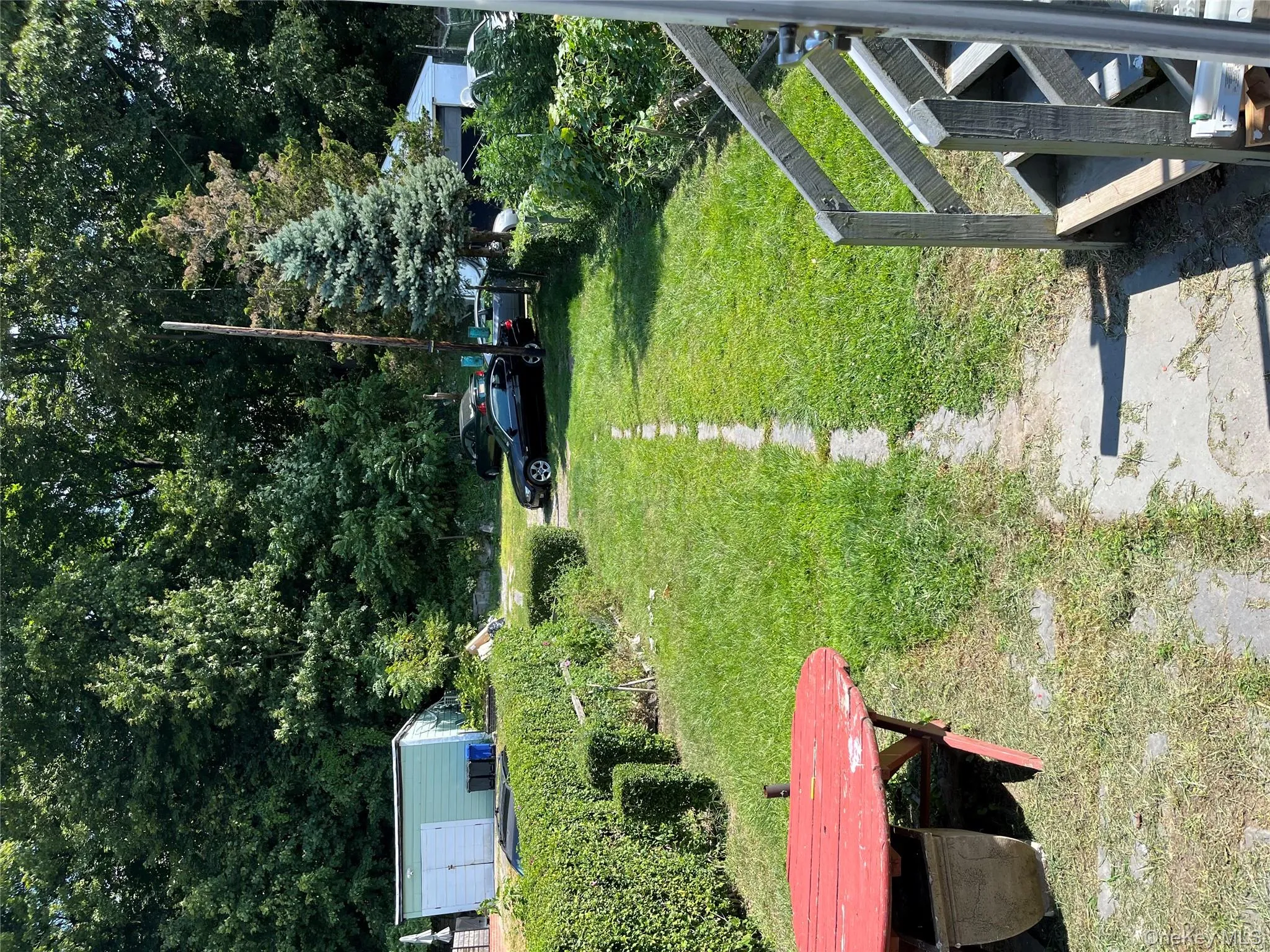 View of green lawn with an outdoor structure View of green lawn with an outdoor structure