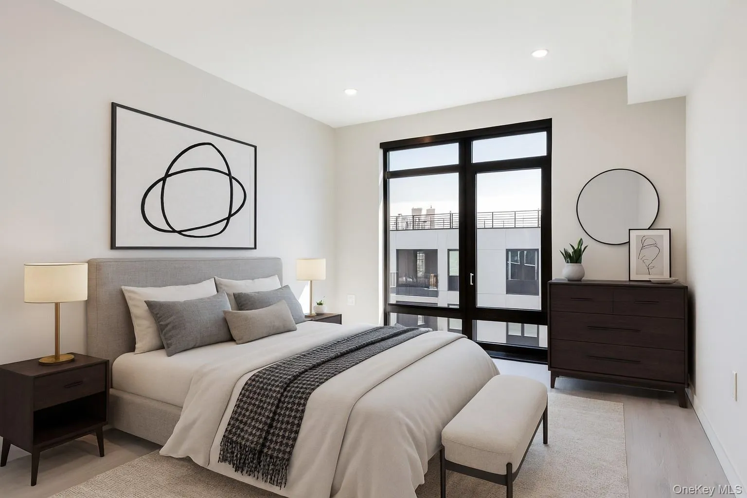 Bedroom with light wood finished floors, access to outside, and recessed lighting Bedroom with light wood finished floors, access to outside, and recessed lighting