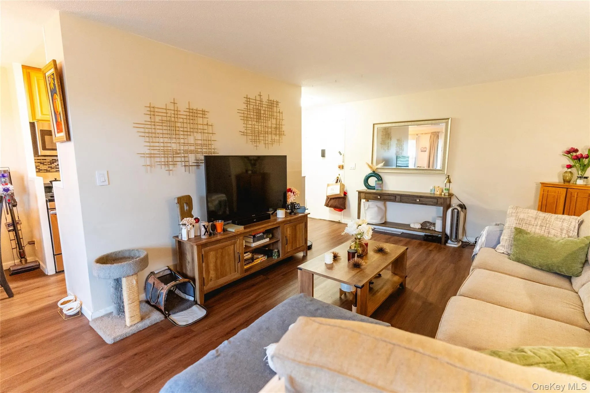 Living area with wood finished floors and baseboards Living area with wood finished floors and baseboards