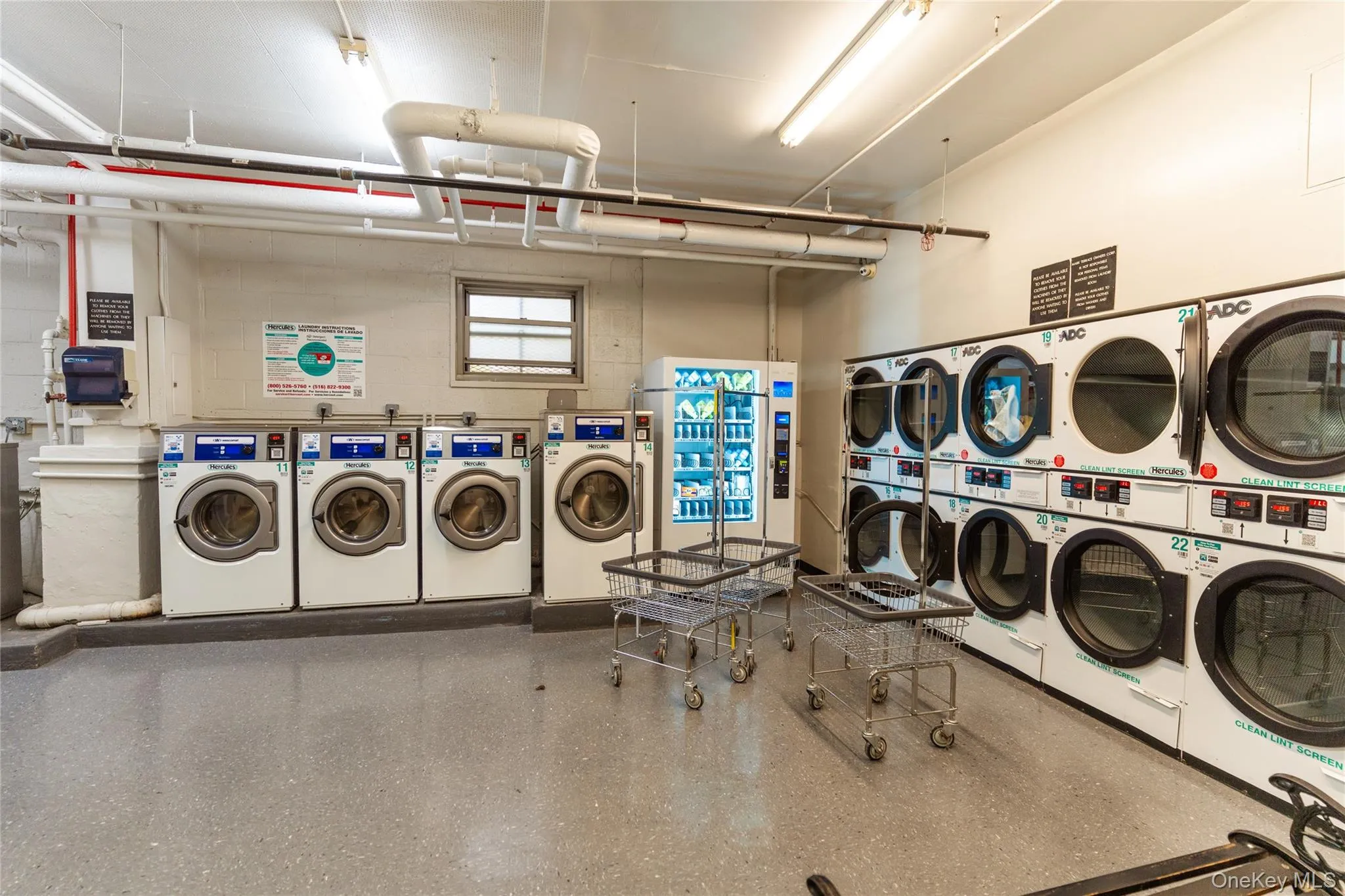 Washroom with washer and clothes dryer and a sink Washroom with washer and clothes dryer and a sink