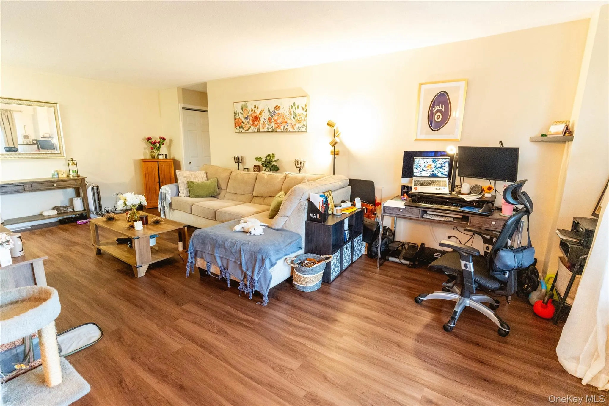 Living room featuring an office area and wood finished floors Living room featuring an office area and wood finished floors