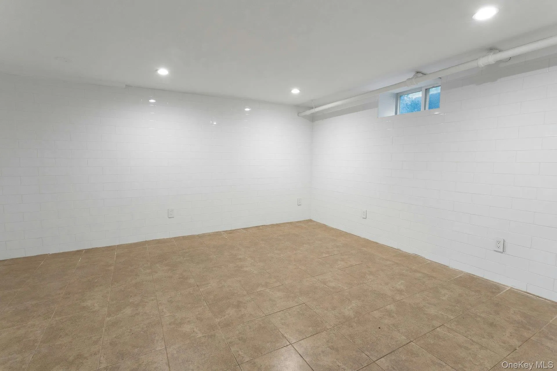 Basement featuring recessed lighting Basement featuring recessed lighting