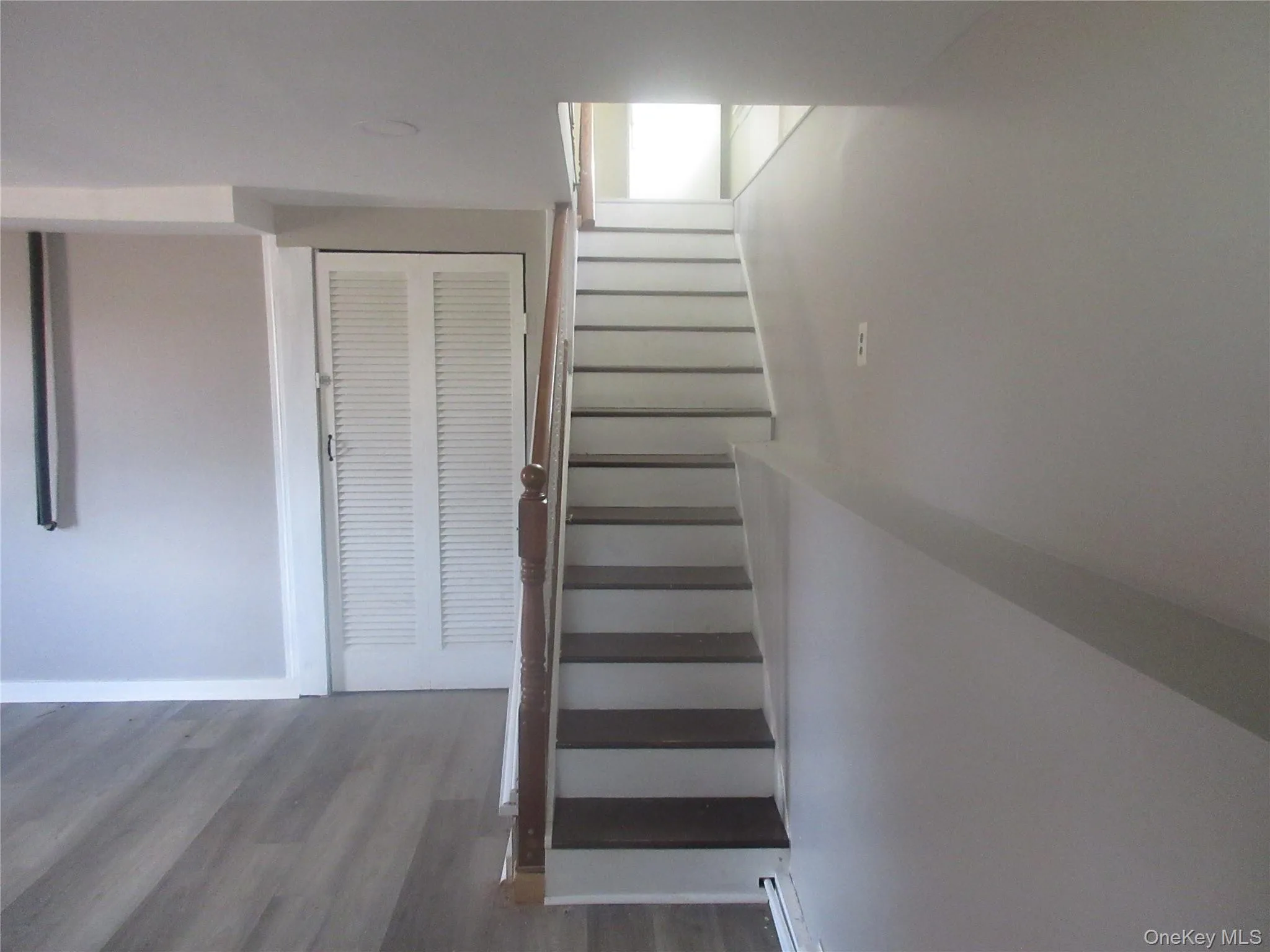 Stairs with wood finished floors and baseboards Stairs with wood finished floors and baseboards
