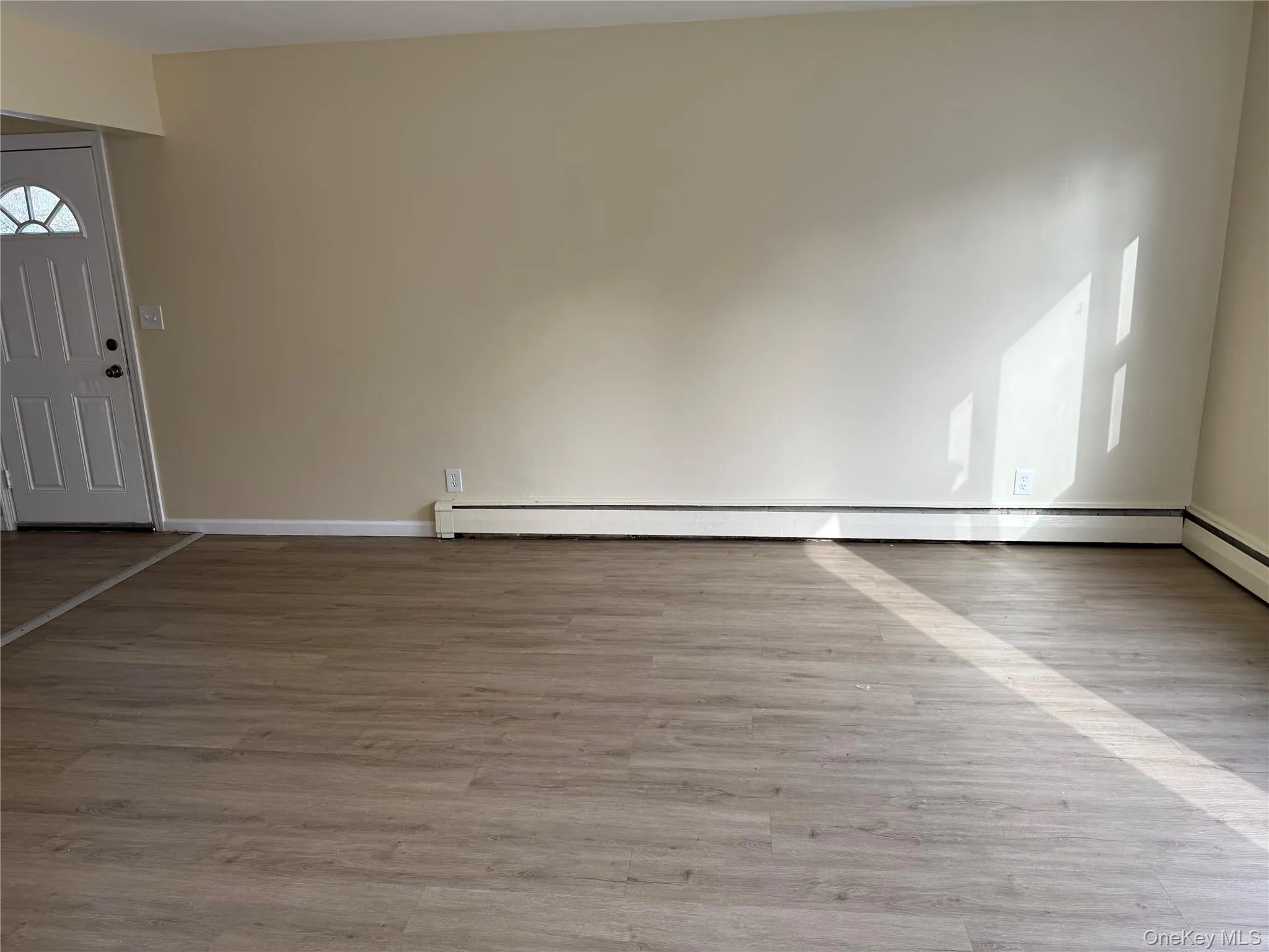 Entryway with light wood finished floors and baseboards Entryway with light wood finished floors and baseboards
