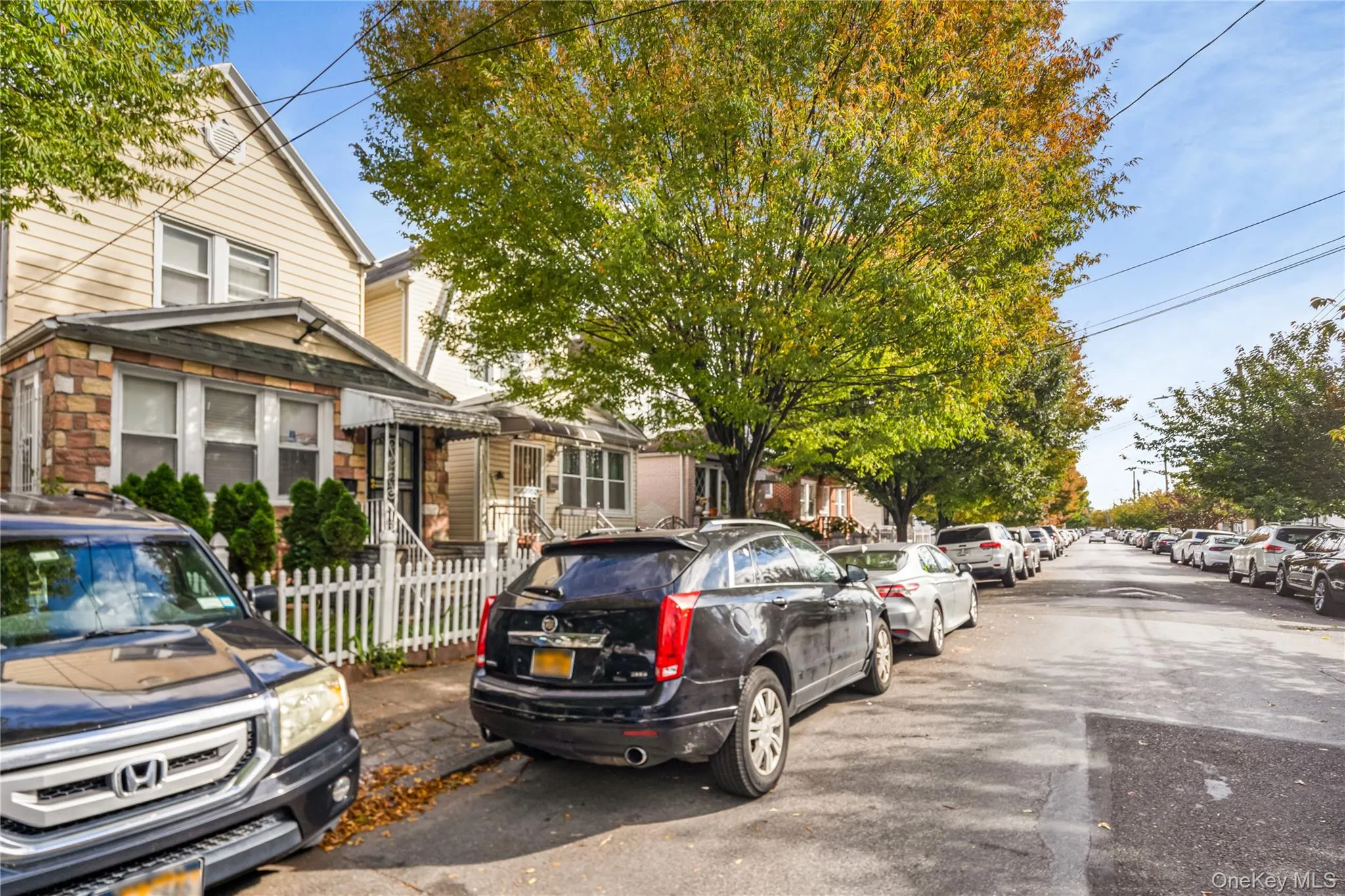 View of asphalt street featuring a residential view View of asphalt street featuring a residential view