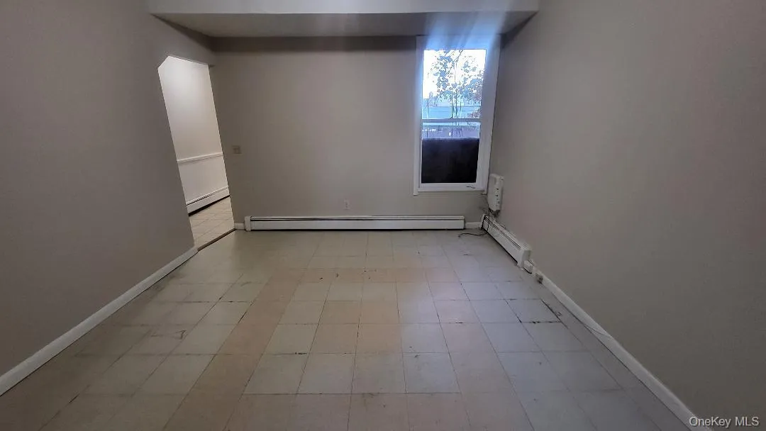 Unfurnished room with baseboard heating Unfurnished room with baseboard heating