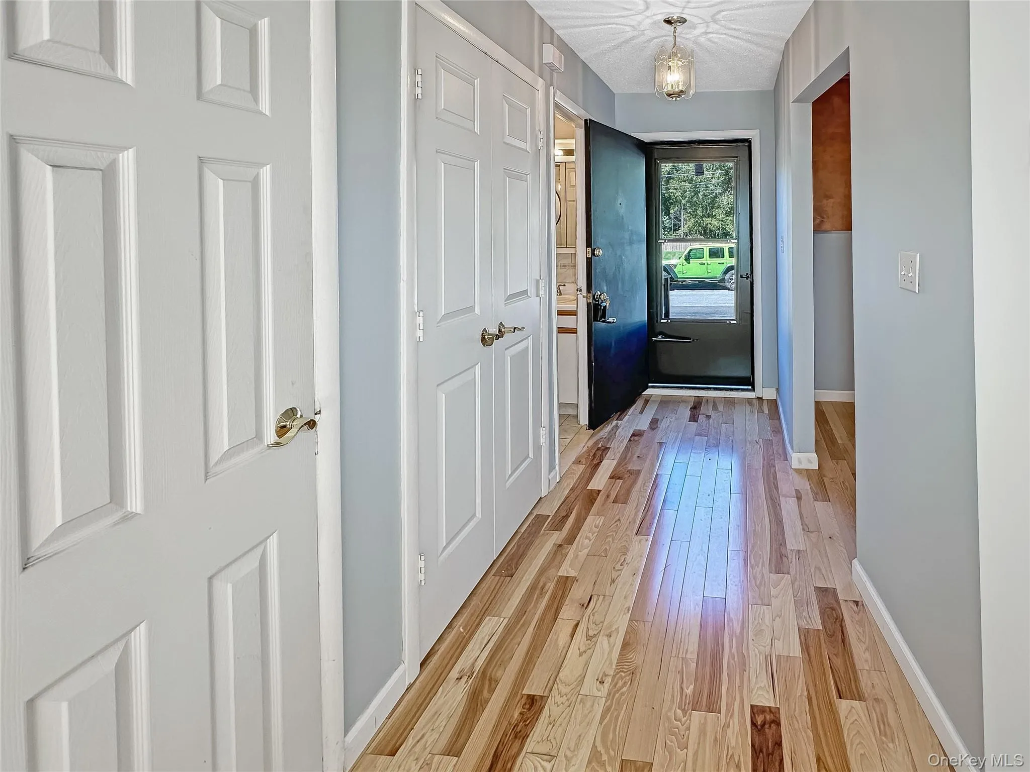 Entryway with wood finished floors and baseboards Entryway with wood finished floors and baseboards