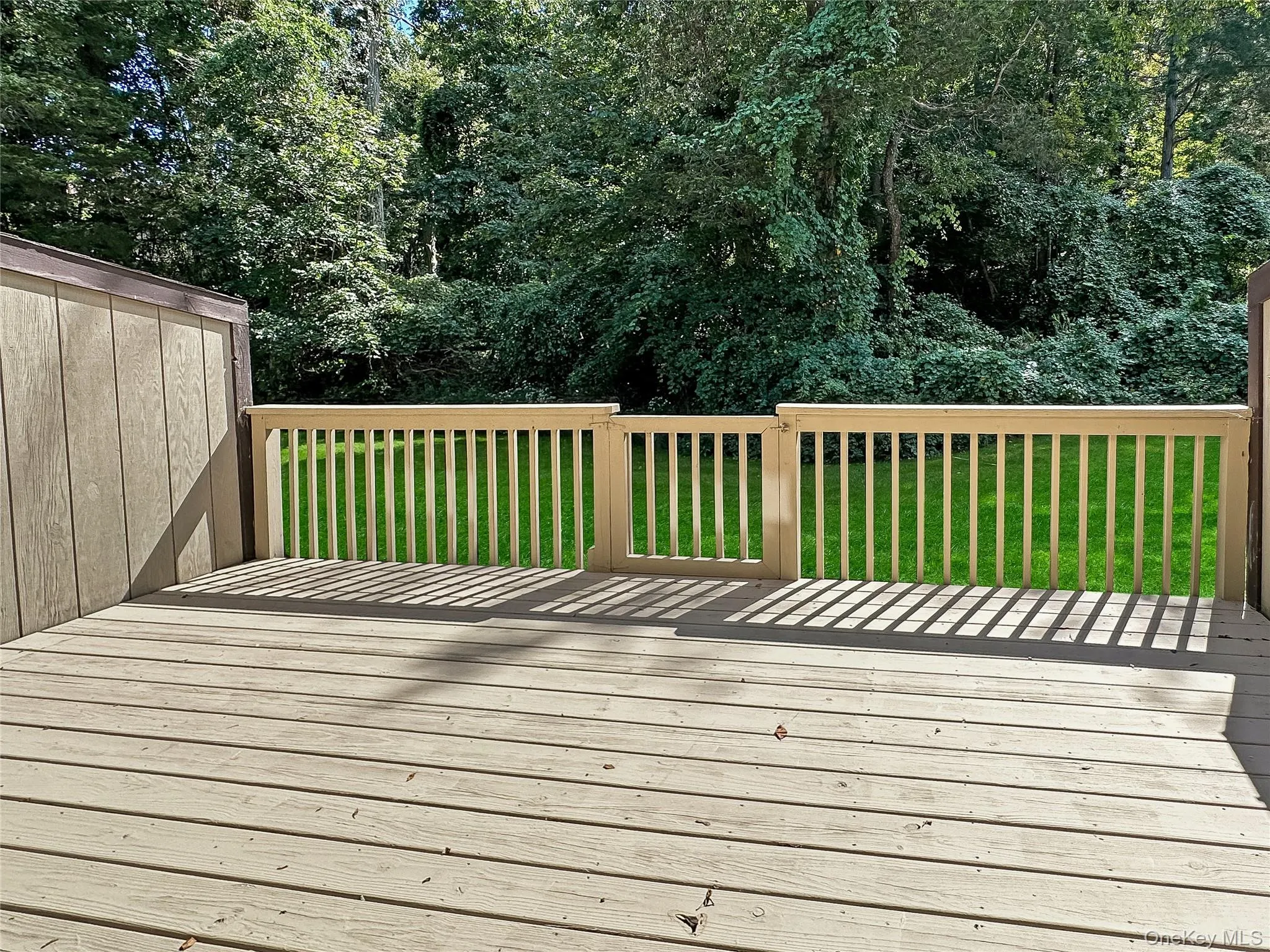 Wooden deck with a lawn Wooden deck with a lawn