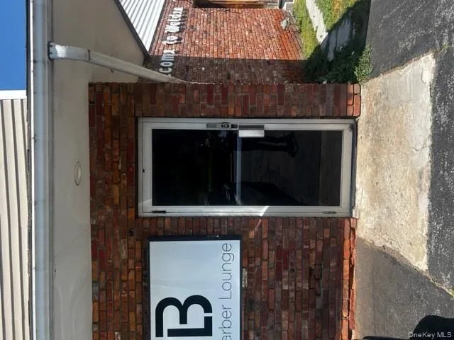 View of exterior entry featuring brick siding View of exterior entry featuring brick siding