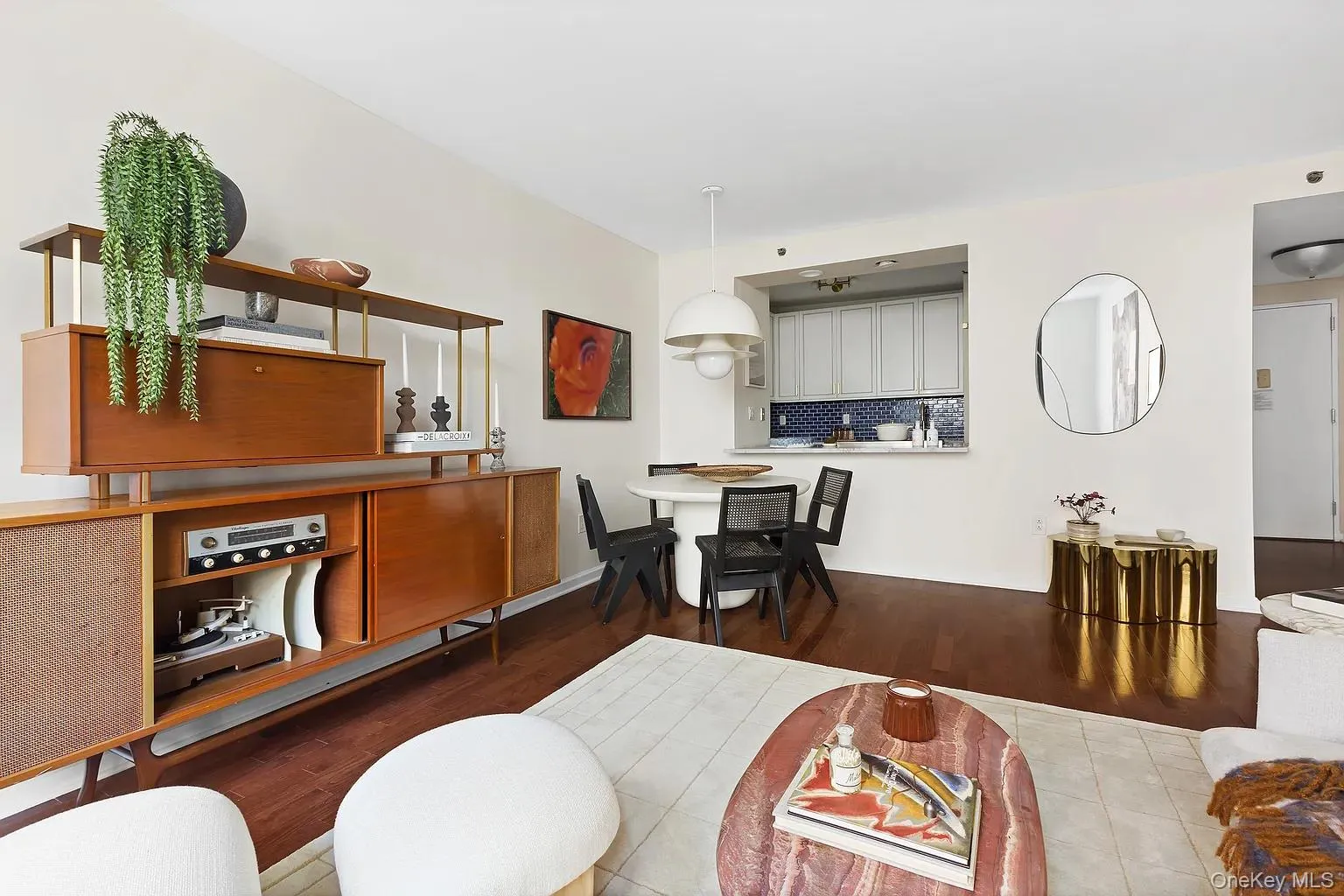 Living room featuring wood finished floors and baseboards Living room featuring wood finished floors and baseboards
