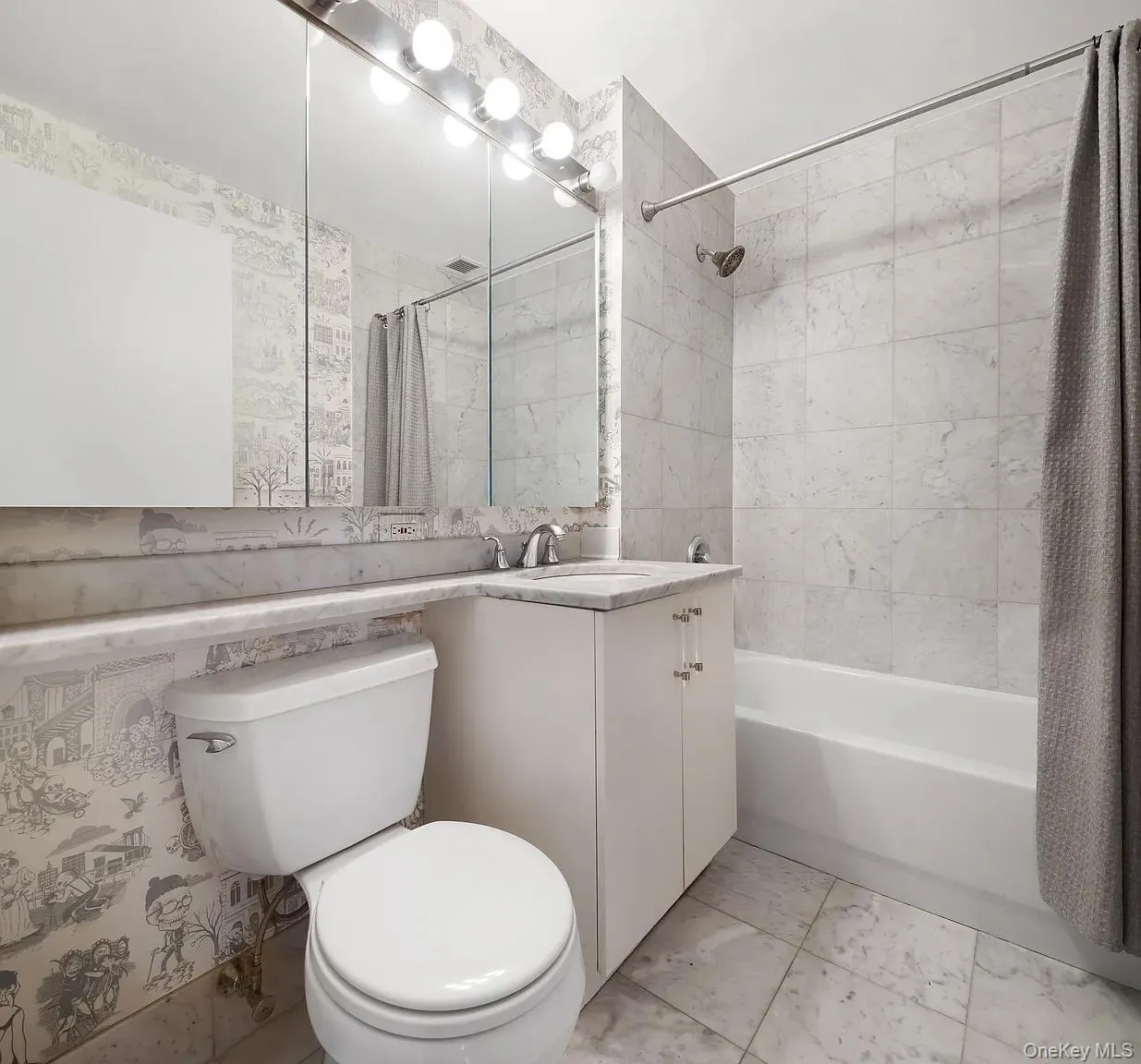 Bathroom featuring vanity and shower / bath combo with shower curtain Bathroom featuring vanity and shower / bath combo with shower curtain