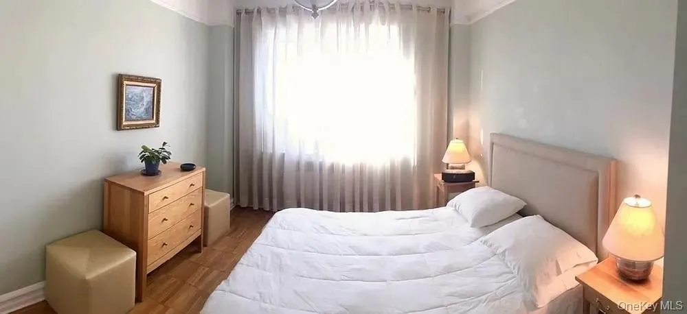 Bedroom featuring wood finished floors Bedroom featuring wood finished floors