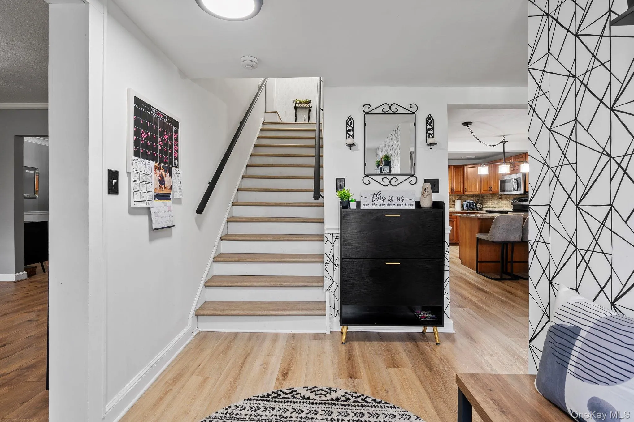 Stairs with wood finished floors and crown molding Stairs with wood finished floors and crown molding