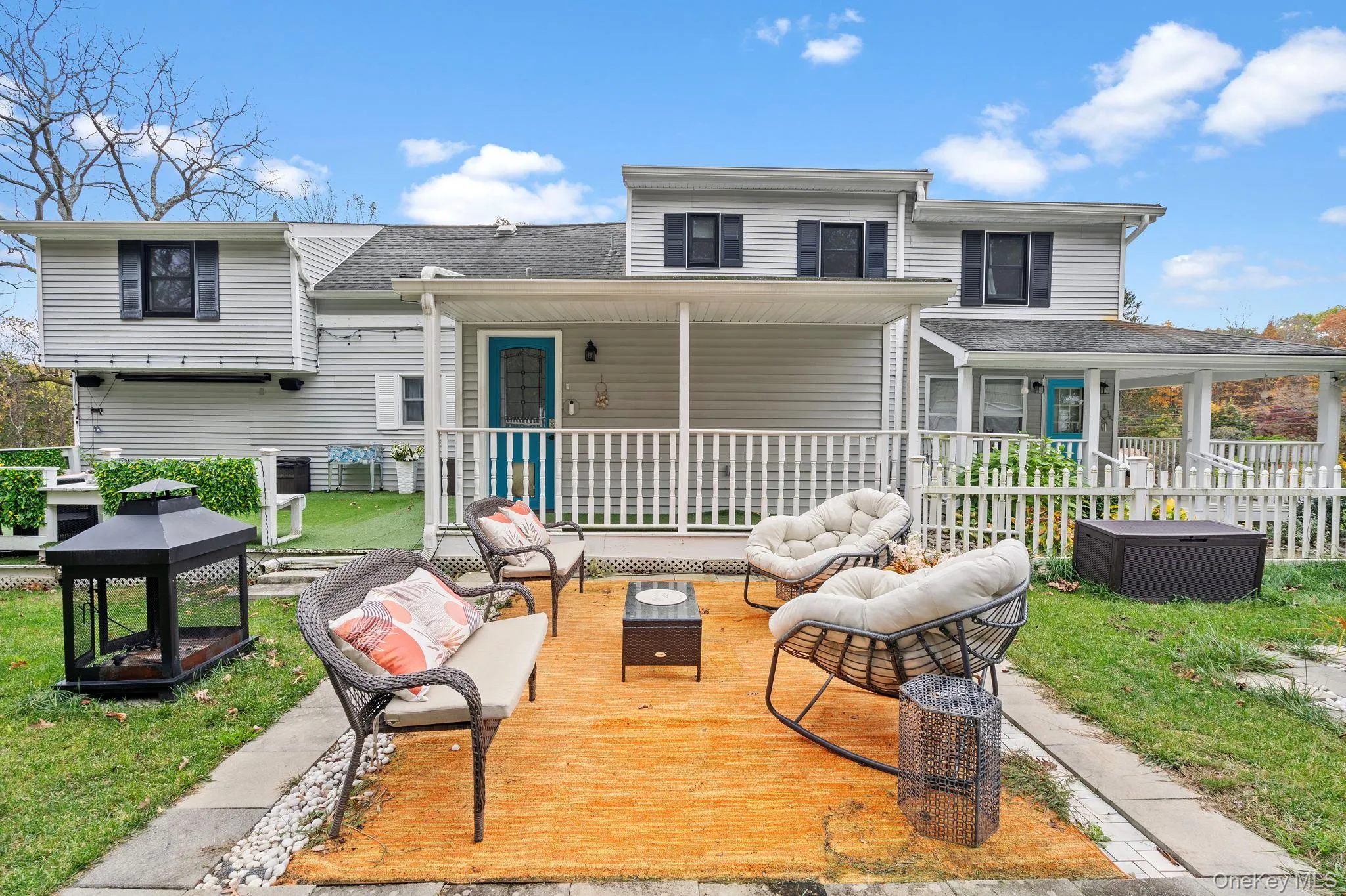 Back of house featuring outdoor lounge area, roof with shingles, and a wooden deck Back of house featuring outdoor lounge area, roof with shingles, and a wooden deck
