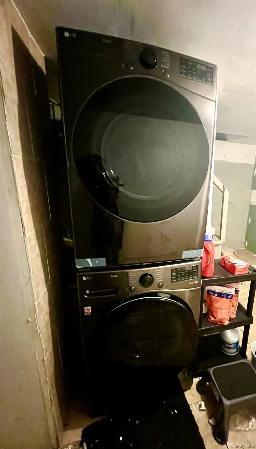 Laundry room with stacked washer and clothes dryer Laundry room with stacked washer and clothes dryer