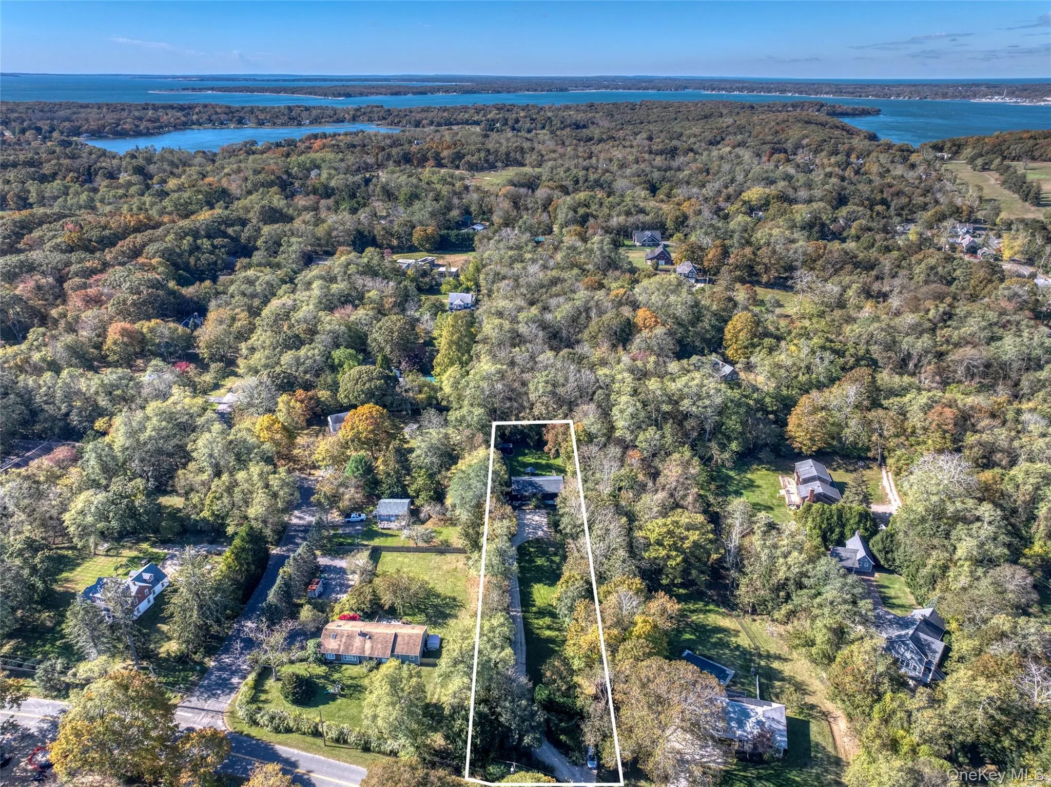 View of property location featuring a large body of water and property boundaries highlighted View of property location featuring a large body of water and property boundaries highlighted