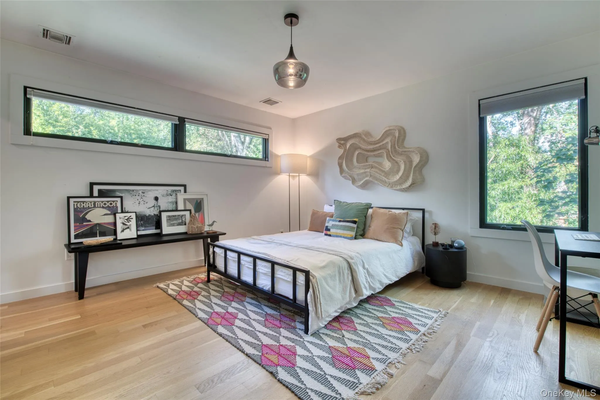 Bedroom with light wood-style flooring Bedroom with light wood-style flooring