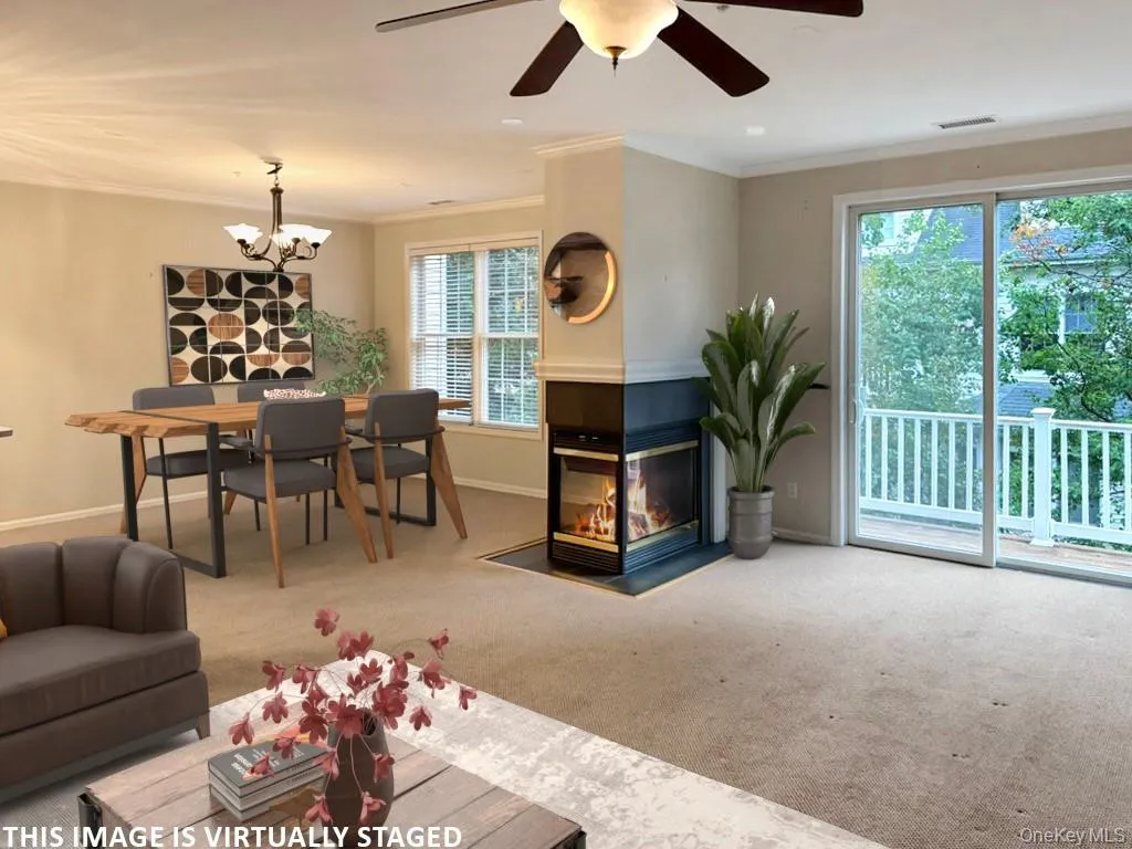 Virtual image of living room/dining room with gas fireplace Virtual image of living room/dining room with gas fireplace