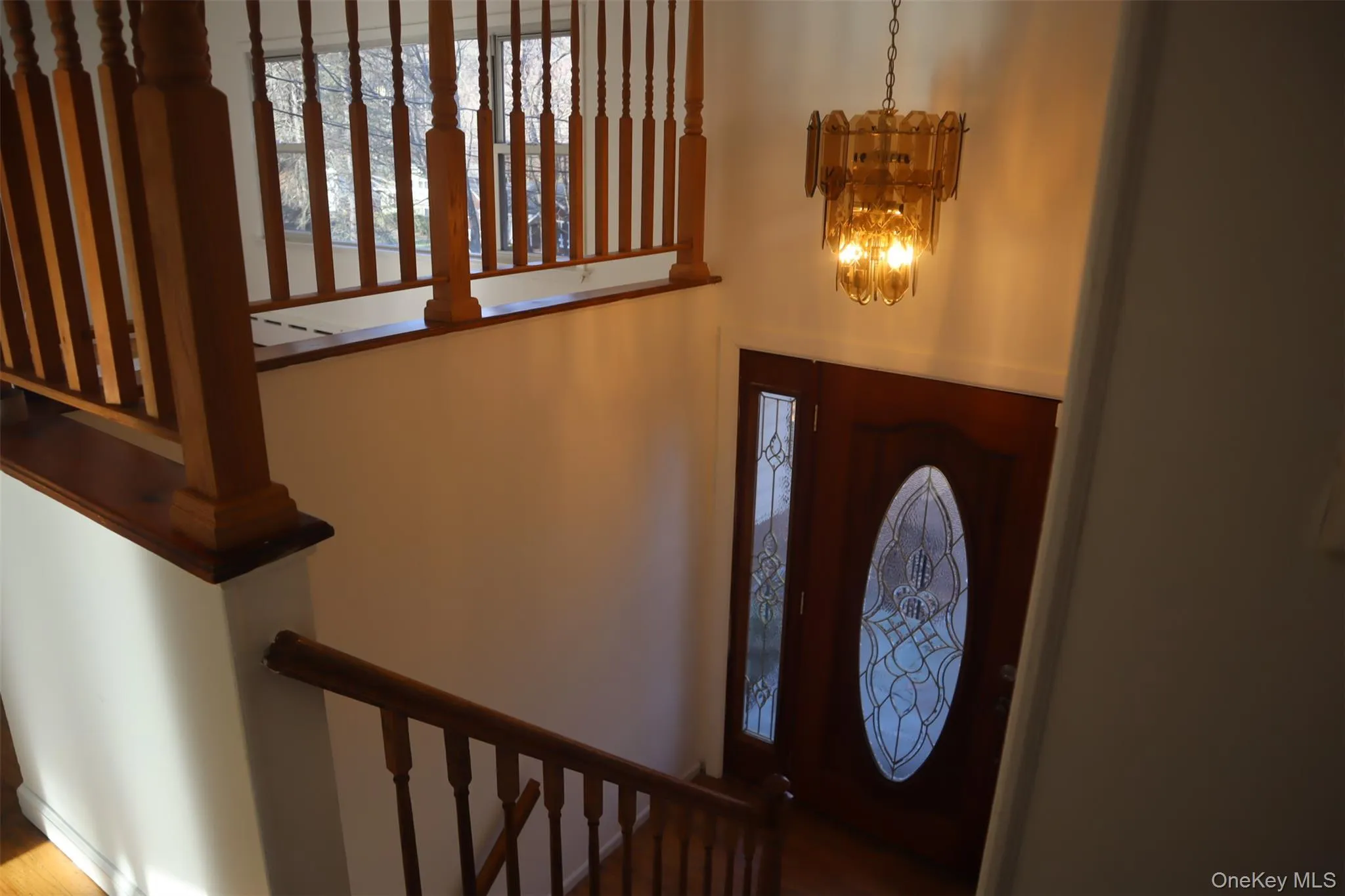 Entrance foyer featuring a chandelier Entrance foyer featuring a chandelier