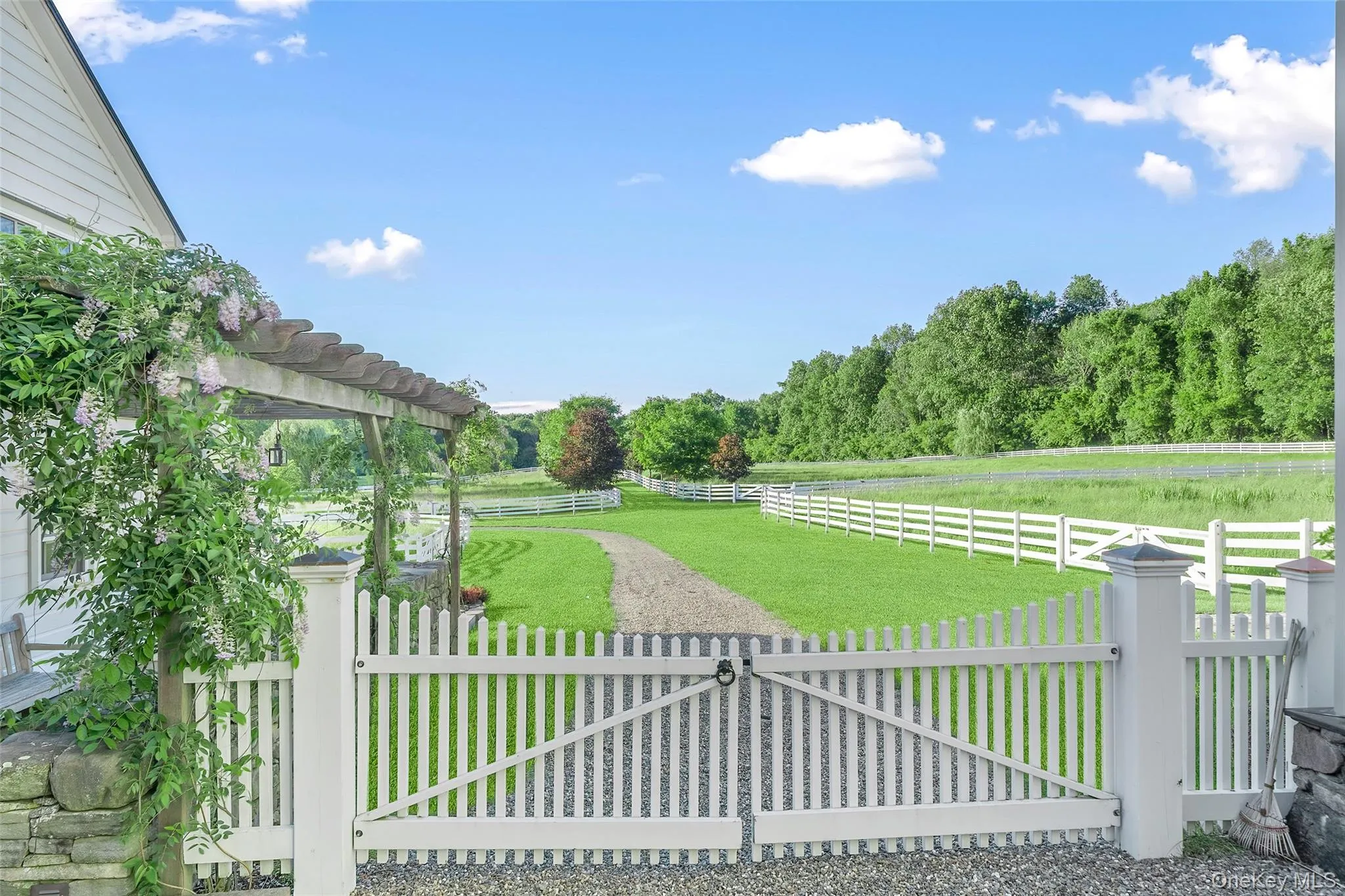 Gate featuring a fenced backyard and a pergola Gate featuring a fenced backyard and a pergola