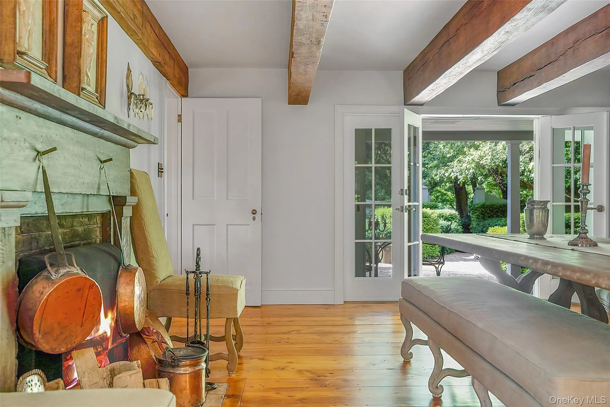 Entryway with beam ceiling and hardwood / wood-style floors Entryway with beam ceiling and hardwood / wood-style floors