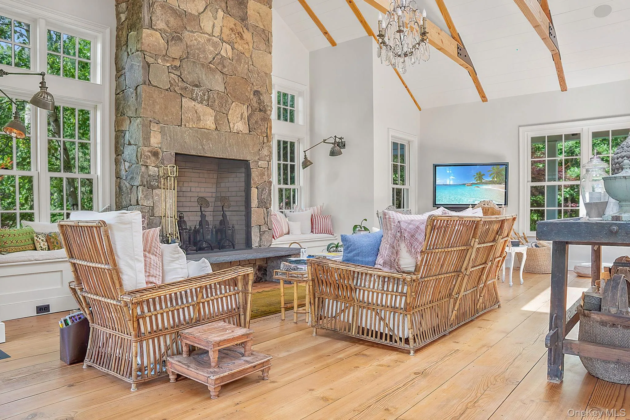 Sunroom with plenty of natural light and a chandelier Sunroom with plenty of natural light and a chandelier