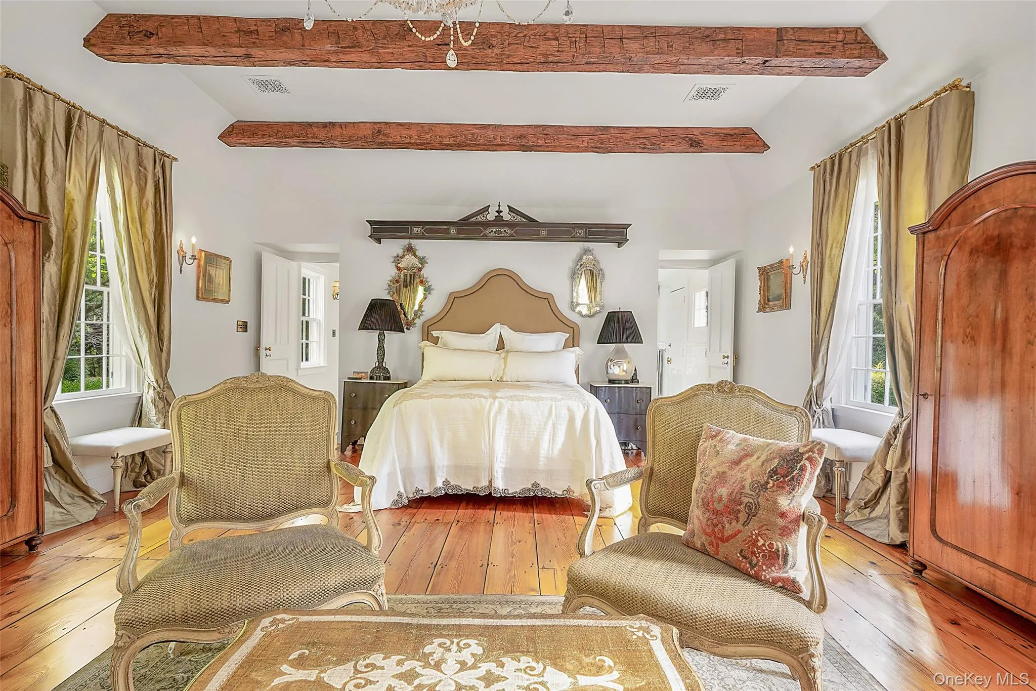 Bedroom featuring hardwood / wood-style flooring and beam ceiling Bedroom featuring hardwood / wood-style flooring and beam ceiling