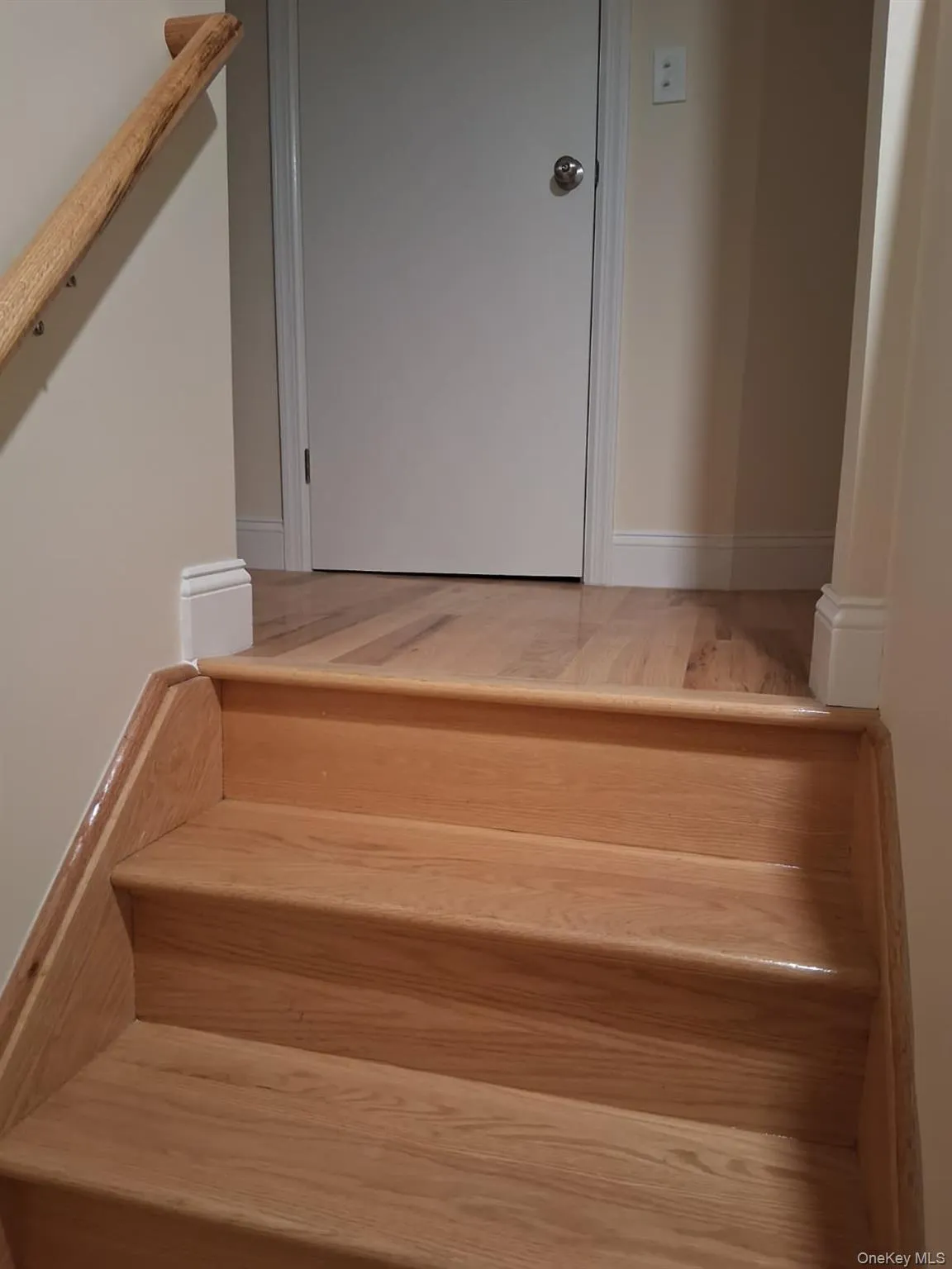 Stairway featuring baseboards Stairway featuring baseboards