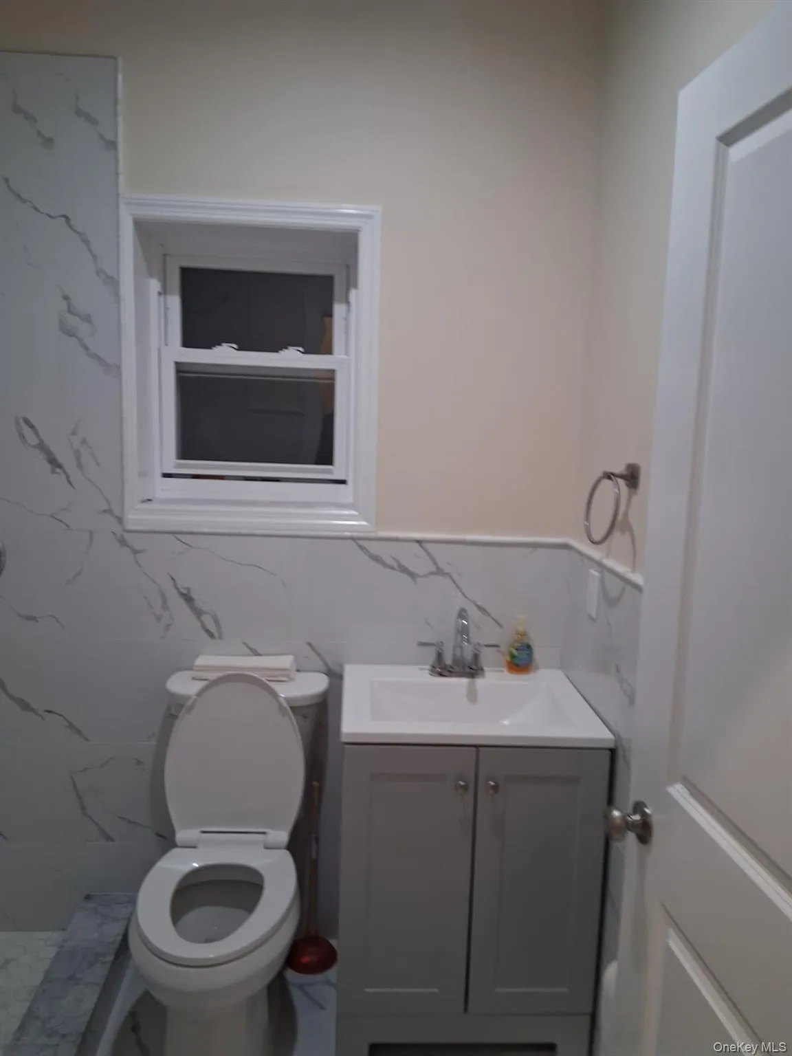 Full bath with tile walls and vanity Full bath with tile walls and vanity