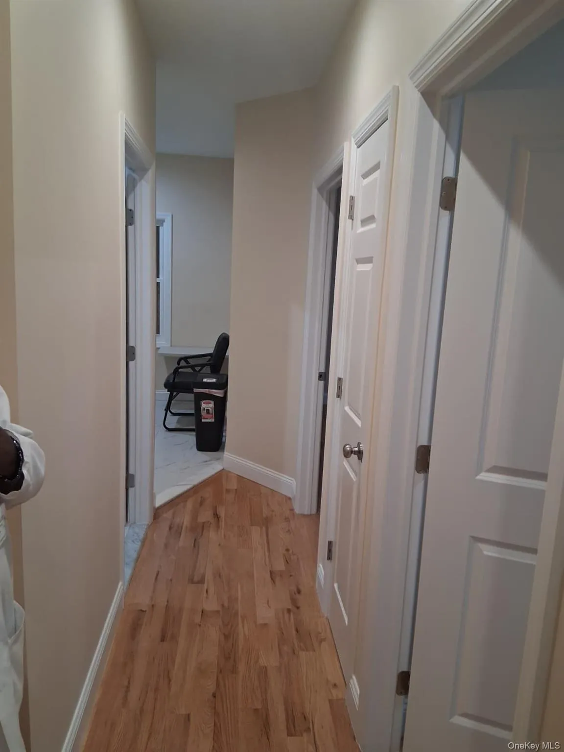 Corridor with light wood finished floors and baseboards Corridor with light wood finished floors and baseboards