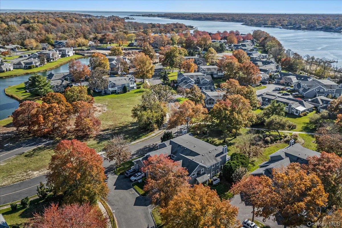 Aerial view of residential area with a large body of water Aerial view of residential area with a large body of water