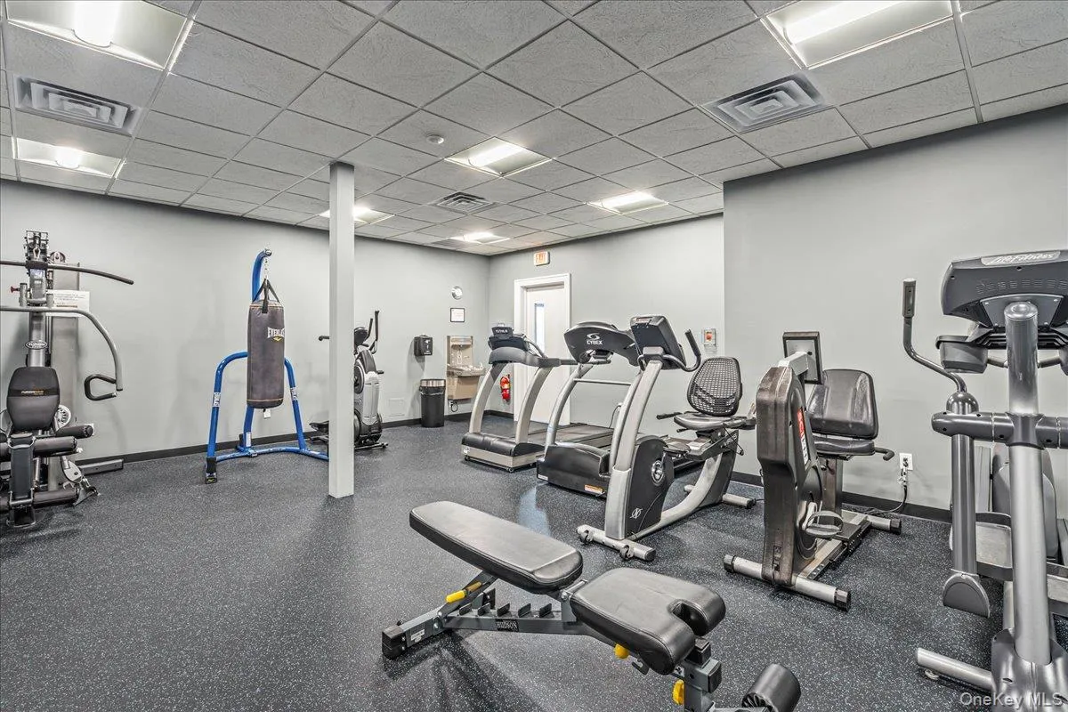Gym featuring a drop ceiling Gym featuring a drop ceiling