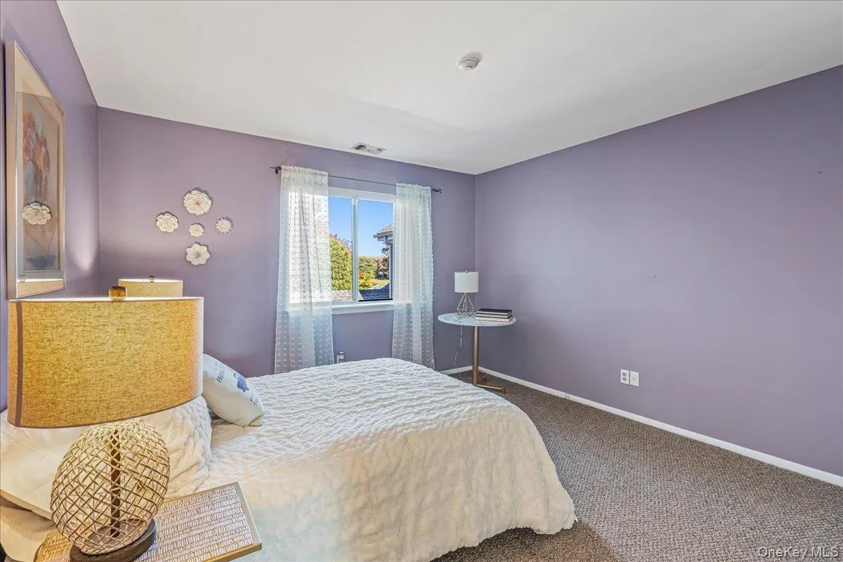 Carpeted bedroom with baseboards Carpeted bedroom with baseboards