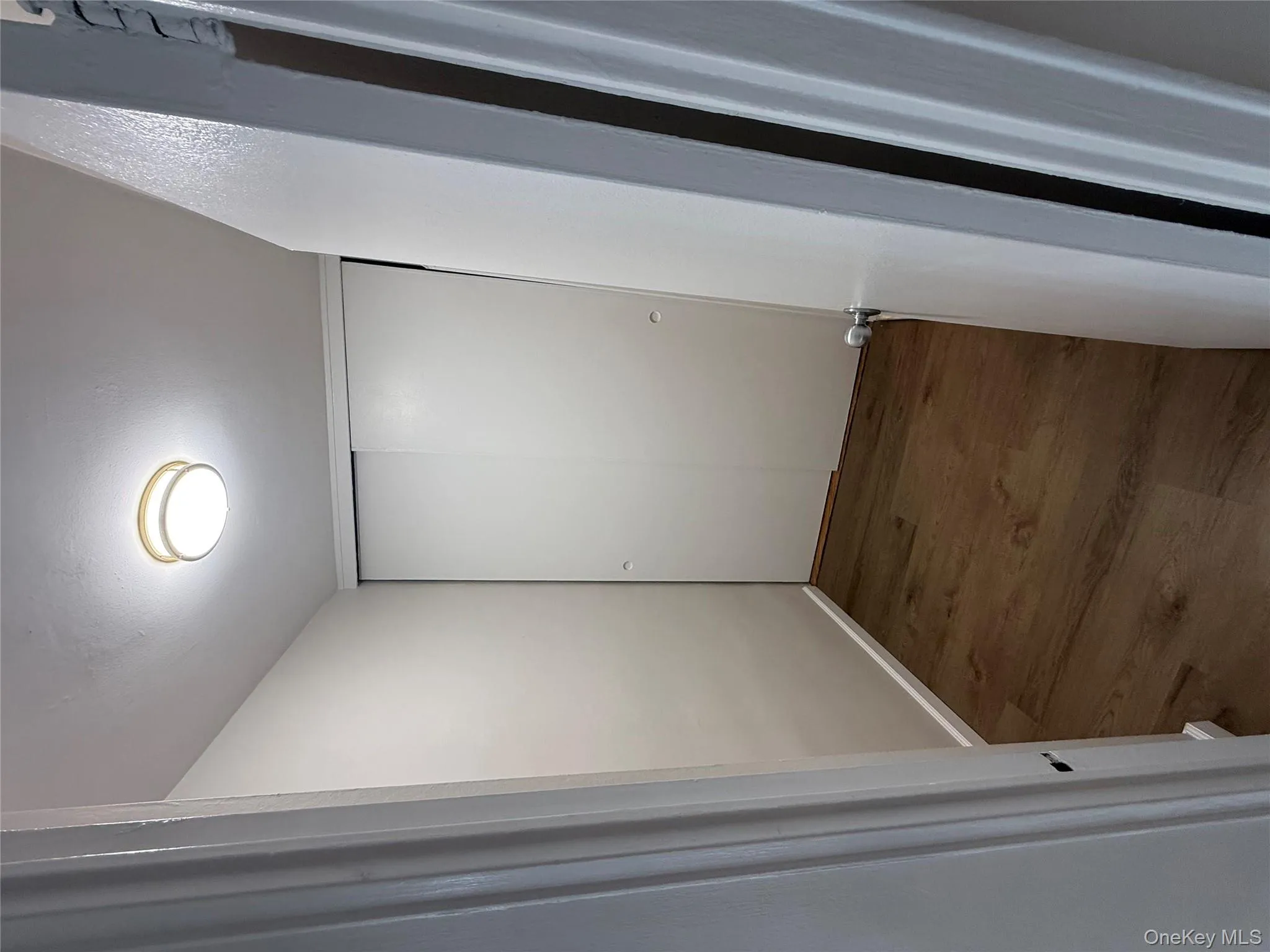 Corridor featuring dark wood-type flooring Corridor featuring dark wood-type flooring