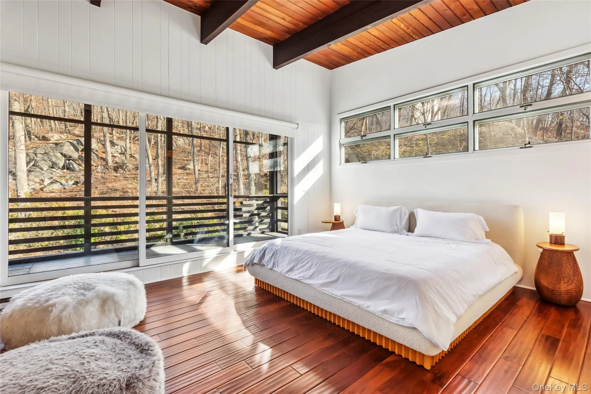 Bedroom with access to exterior, wooden ceiling, beamed ceiling, and wood-type flooring Bedroom with access to exterior, wooden ceiling, beamed ceiling, and wood-type flooring