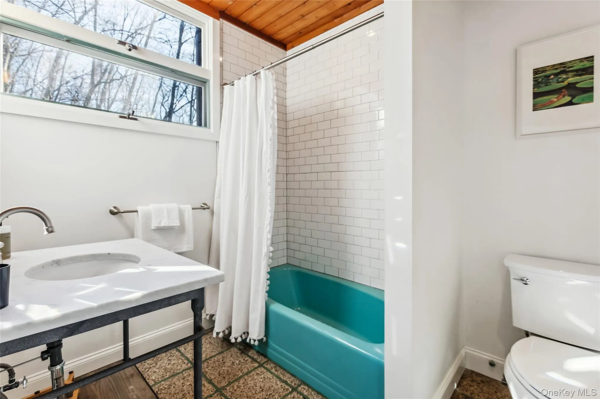 En-suite full bathroom featuring shower / bath combination with curtain, toilet, wooden ceiling, and sink En-suite full bathroom featuring shower / bath combination with curtain, toilet, wooden ceiling, and sink
