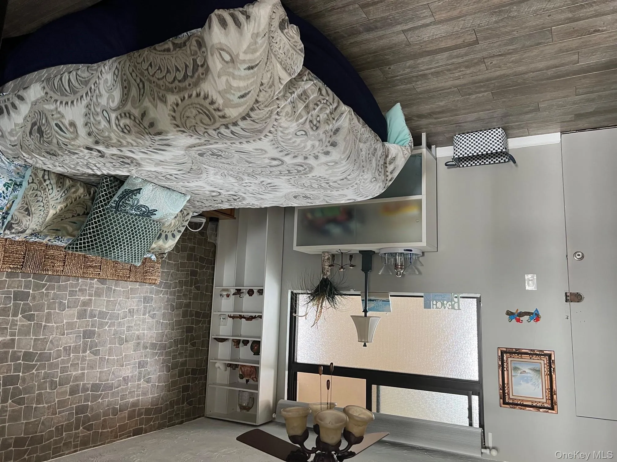 Bedroom featuring dark wood-type flooring, a textured ceiling, and ceiling fan Bedroom featuring dark wood-type flooring, a textured ceiling, and ceiling fan