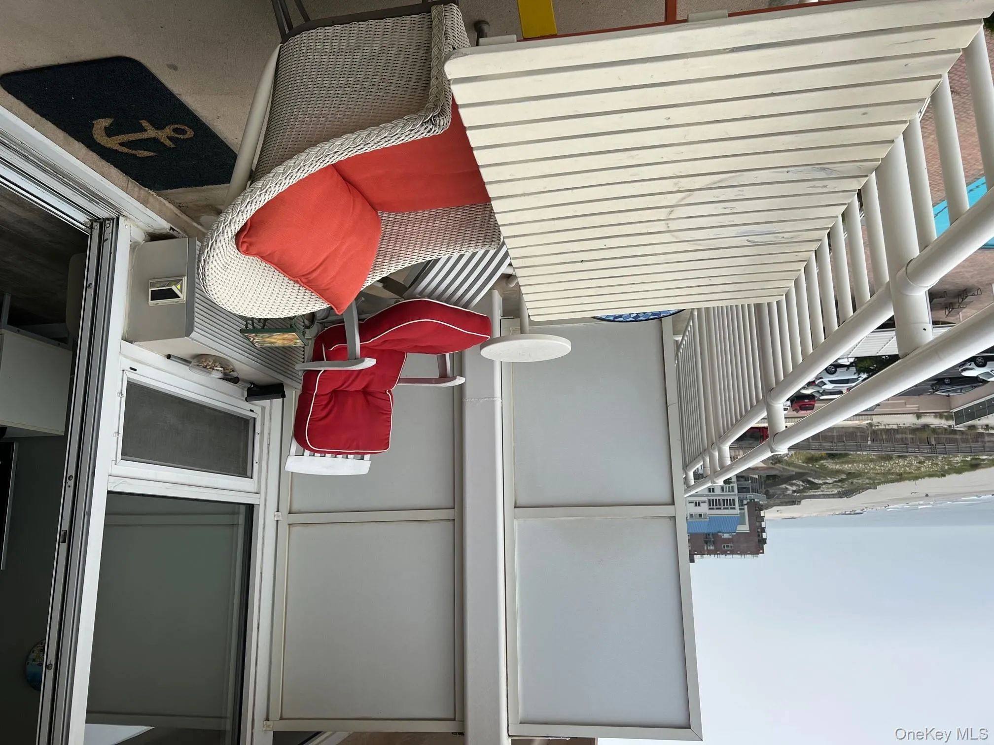 Balcony featuring view of water and beach Balcony featuring view of water and beach