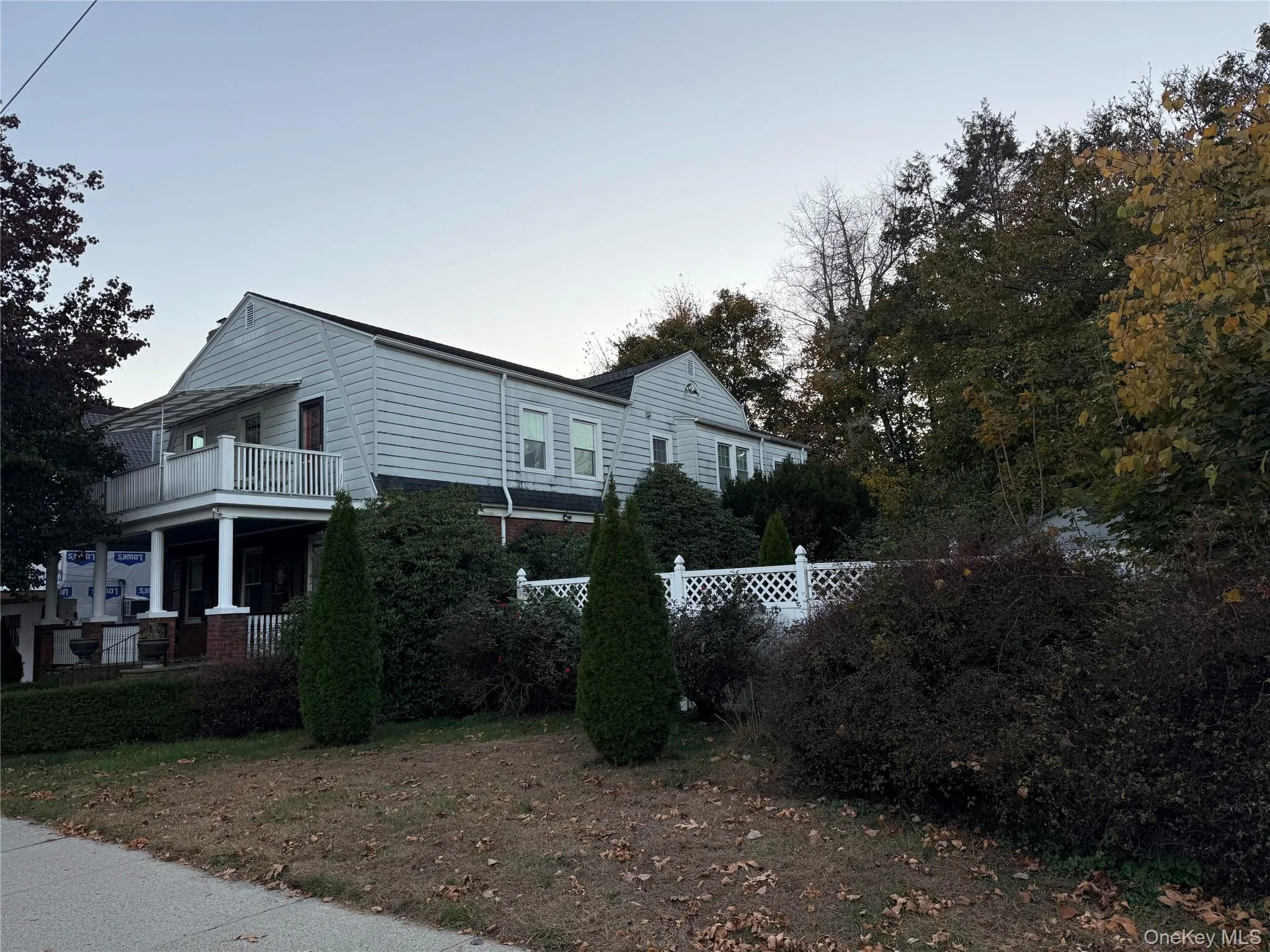 View of home's exterior featuring a balcony View of home's exterior featuring a balcony