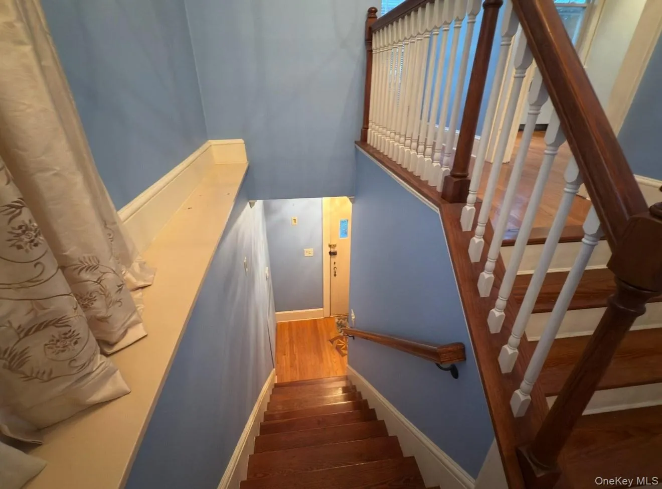 Stairway with wood finished floors and baseboards Stairway with wood finished floors and baseboards
