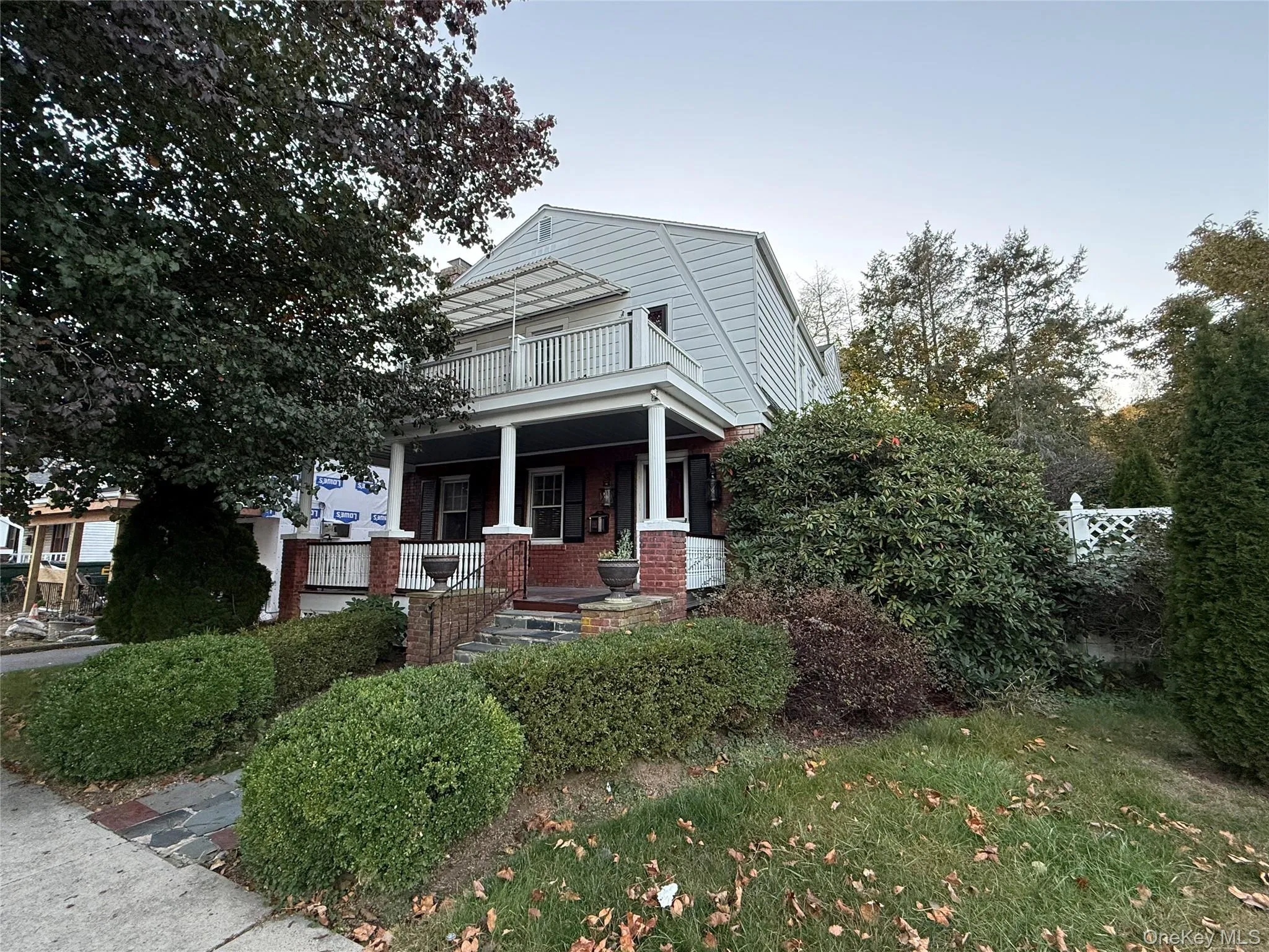 View of front of property featuring covered porch and brick siding View of front of property featuring covered porch and brick siding