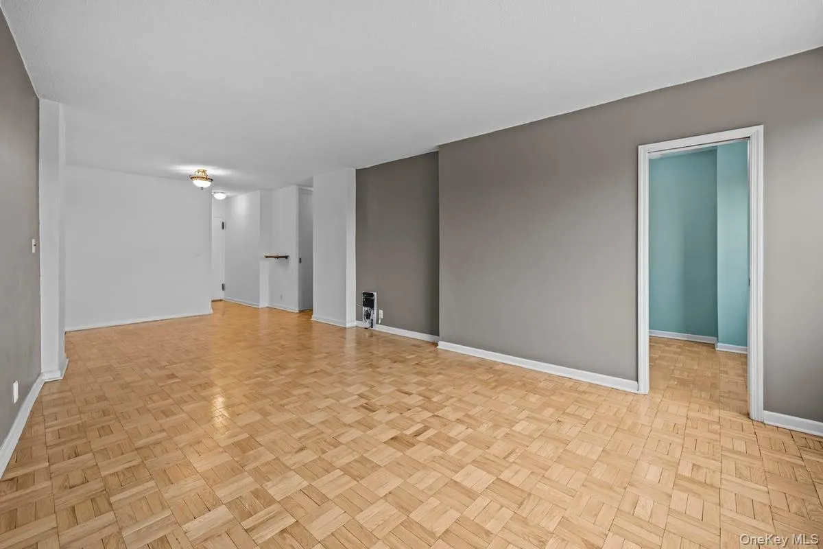 Unfurnished room with baseboards Unfurnished room with baseboards