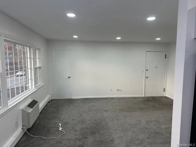 Empty room featuring recessed lighting and carpet floors Empty room featuring recessed lighting and carpet floors